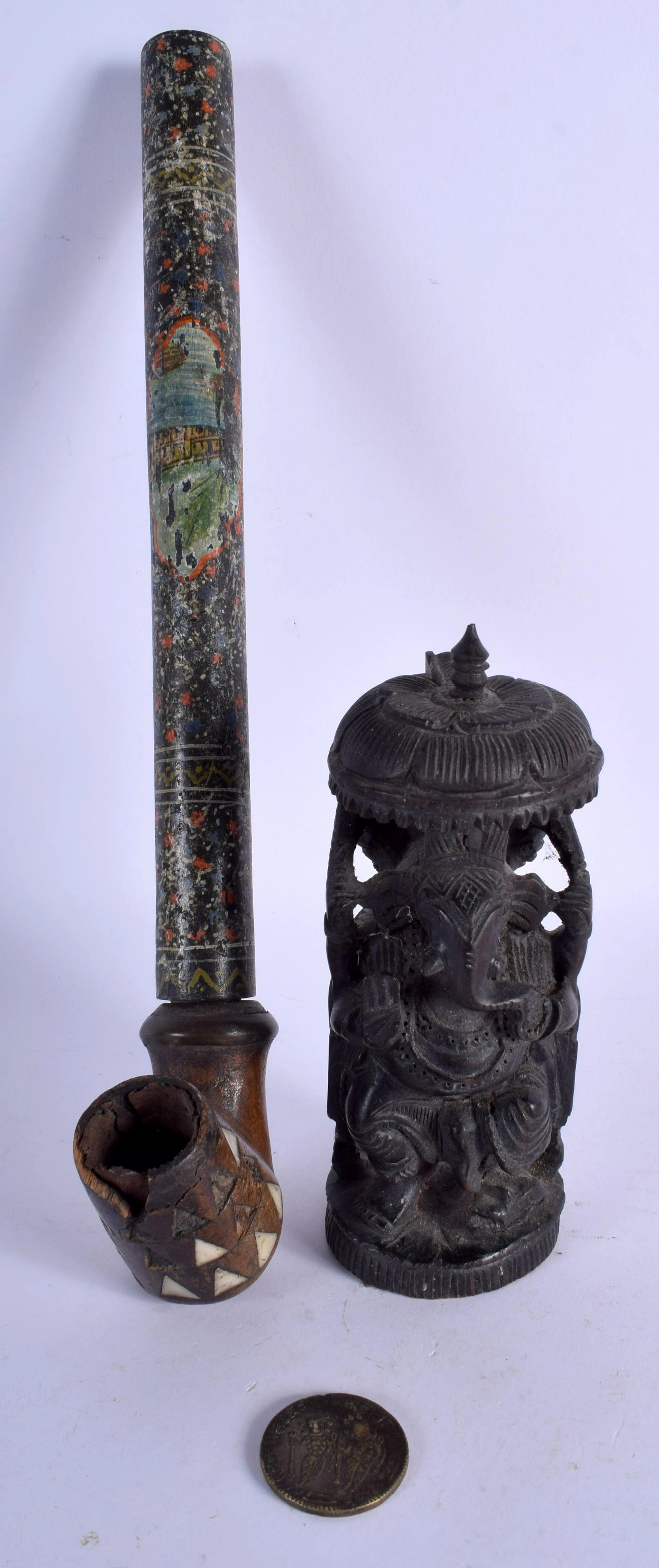 A VINTAGE INDIAN TEMPLE COIN TOKEN together with a pipe