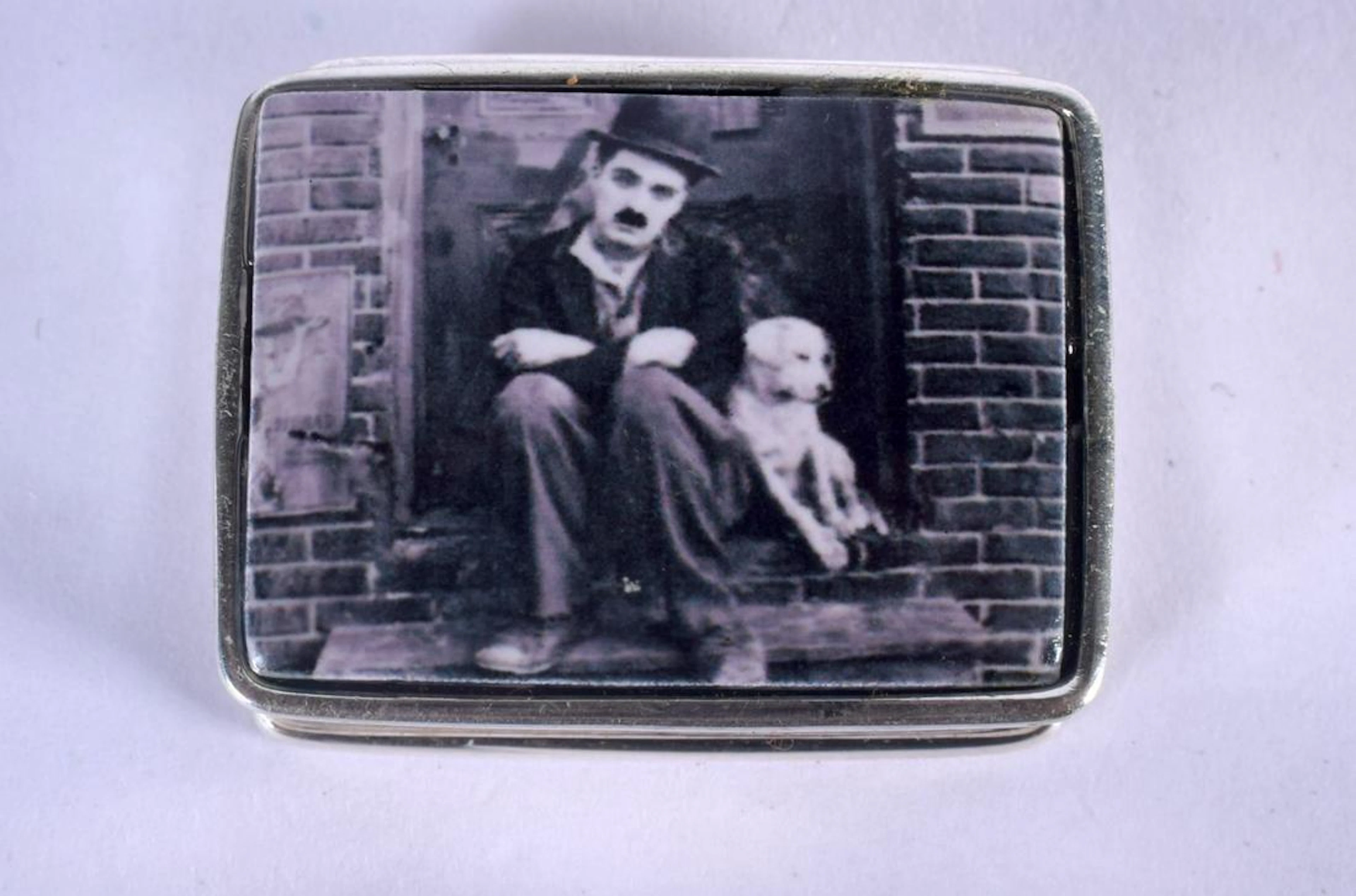 A SILVER CHARLIE CHAPLIN PILL BOX. 20 grams. 3.5 cm x