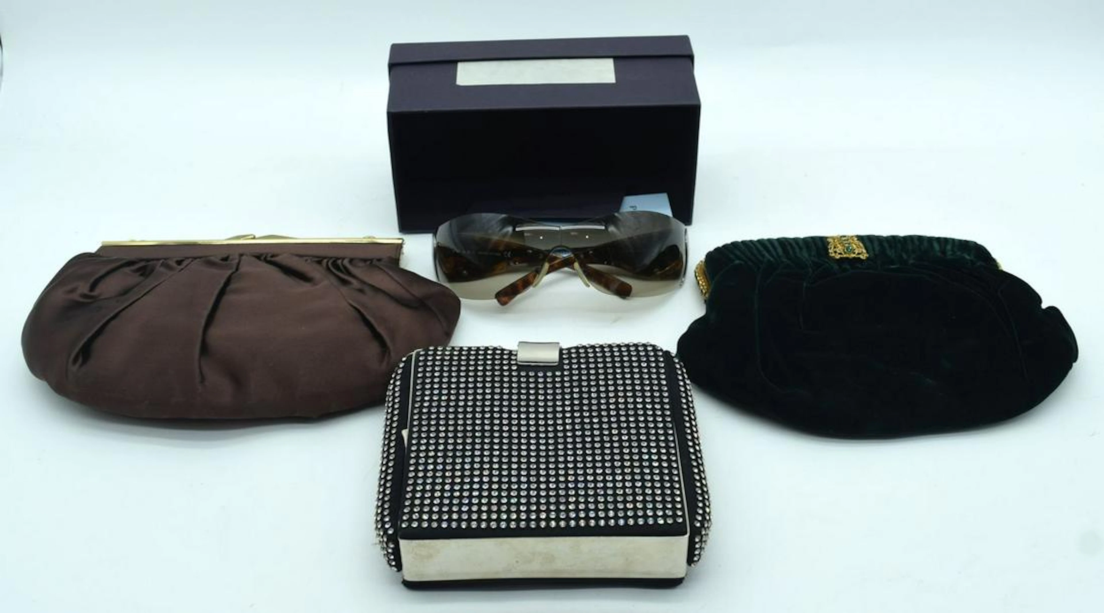 A collection of Vintage handbags and a pair of Prada
