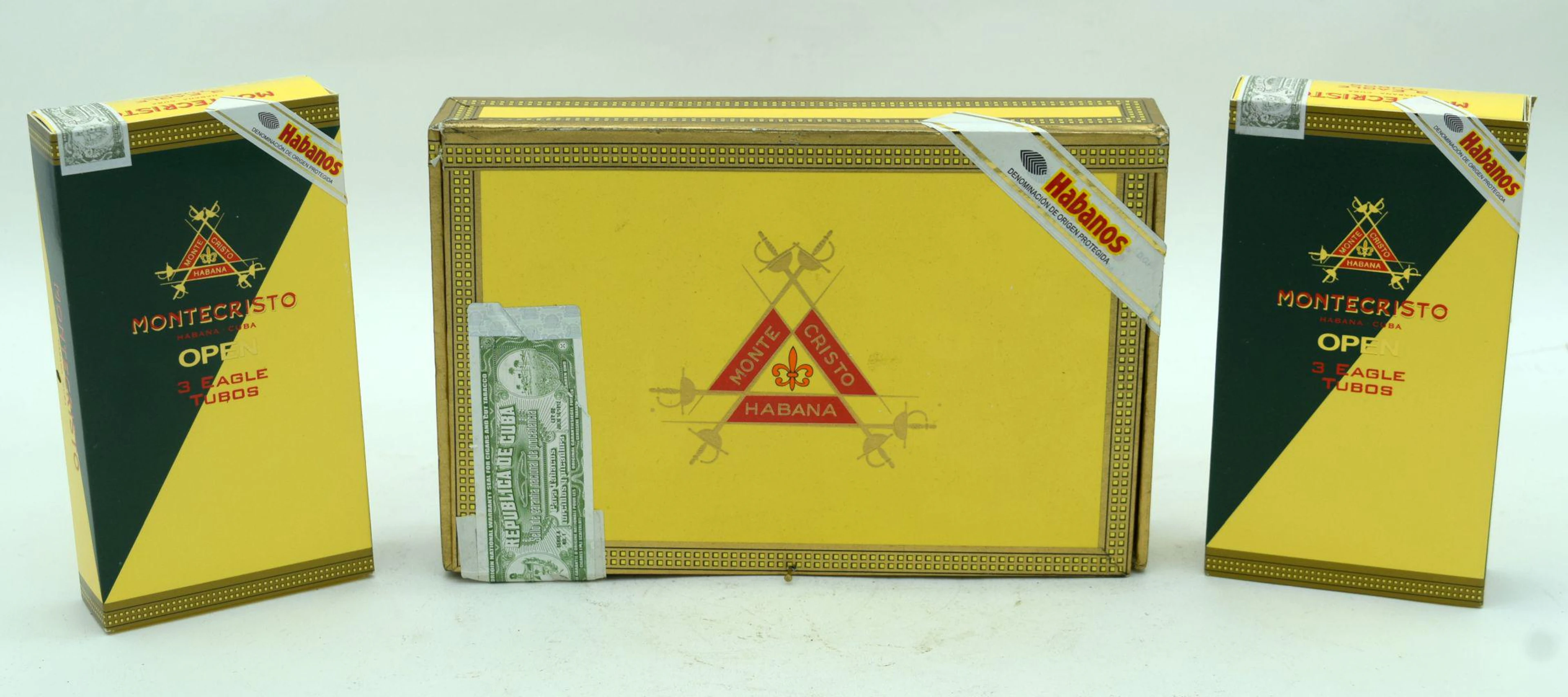 Montecristo Number 4 Cuban cigars together with two