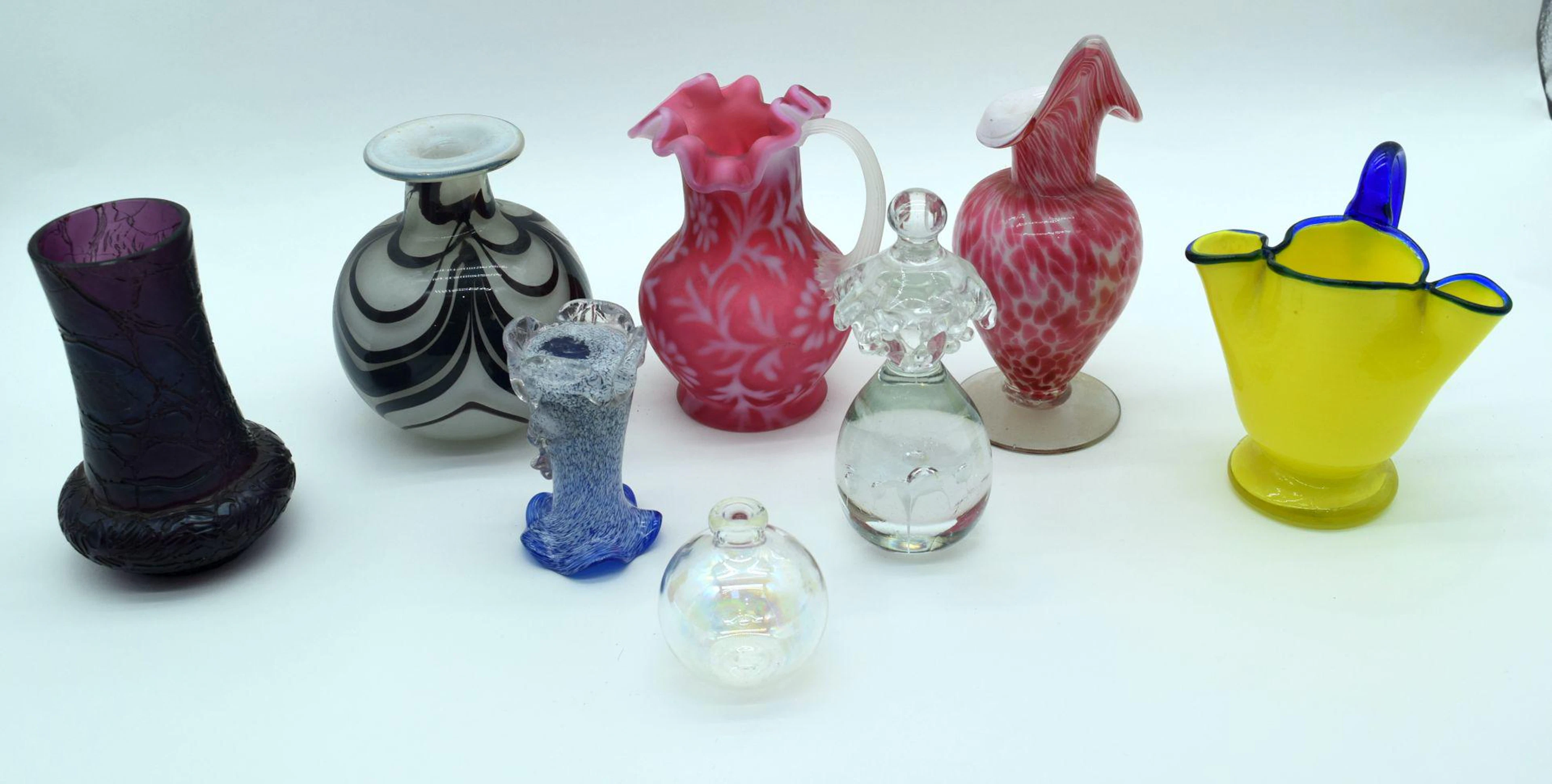 A small collection of glass vases and decorative items