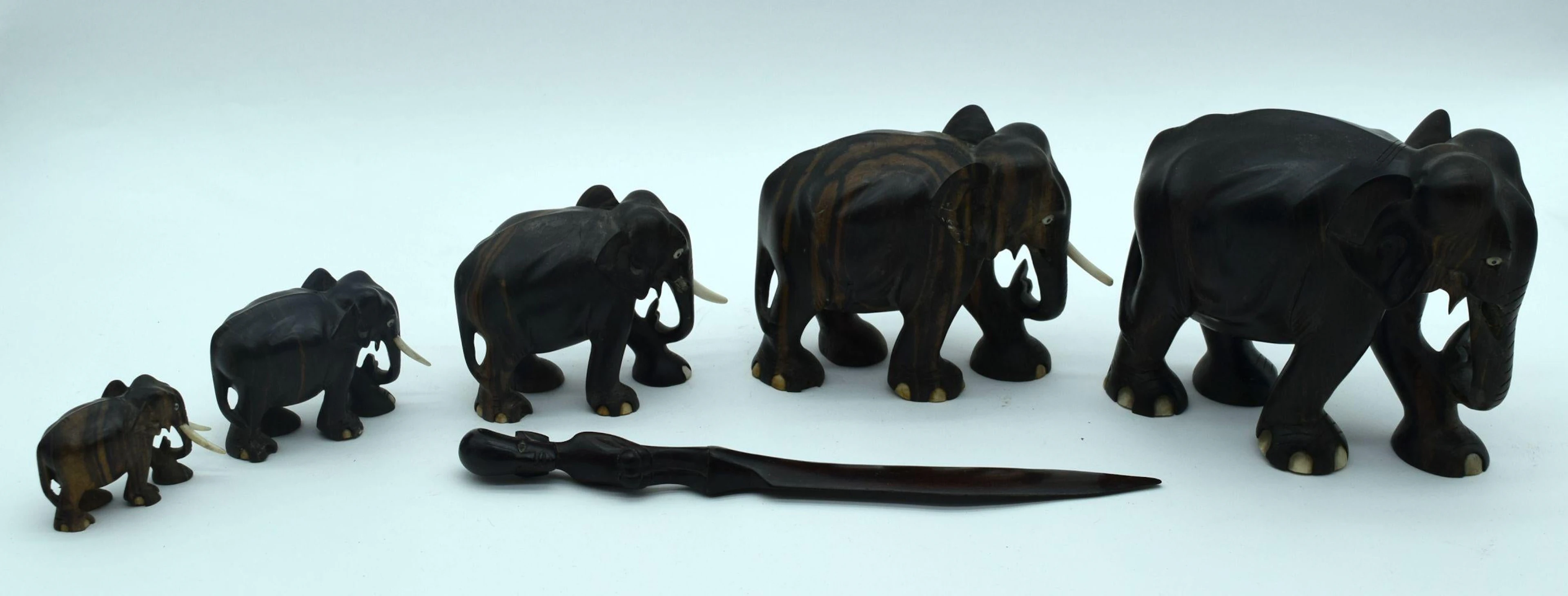 A Collection of African wooden Elephants and a page