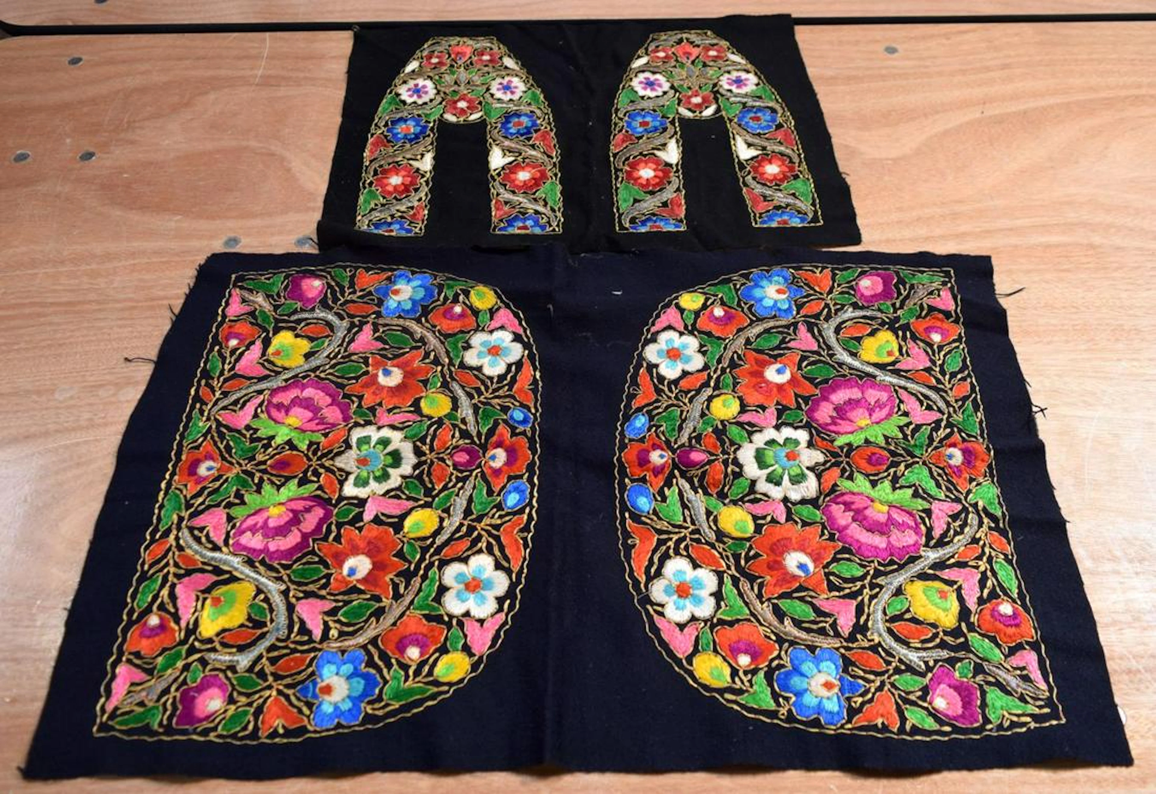 A metal thread and fabric embroider panel with a
