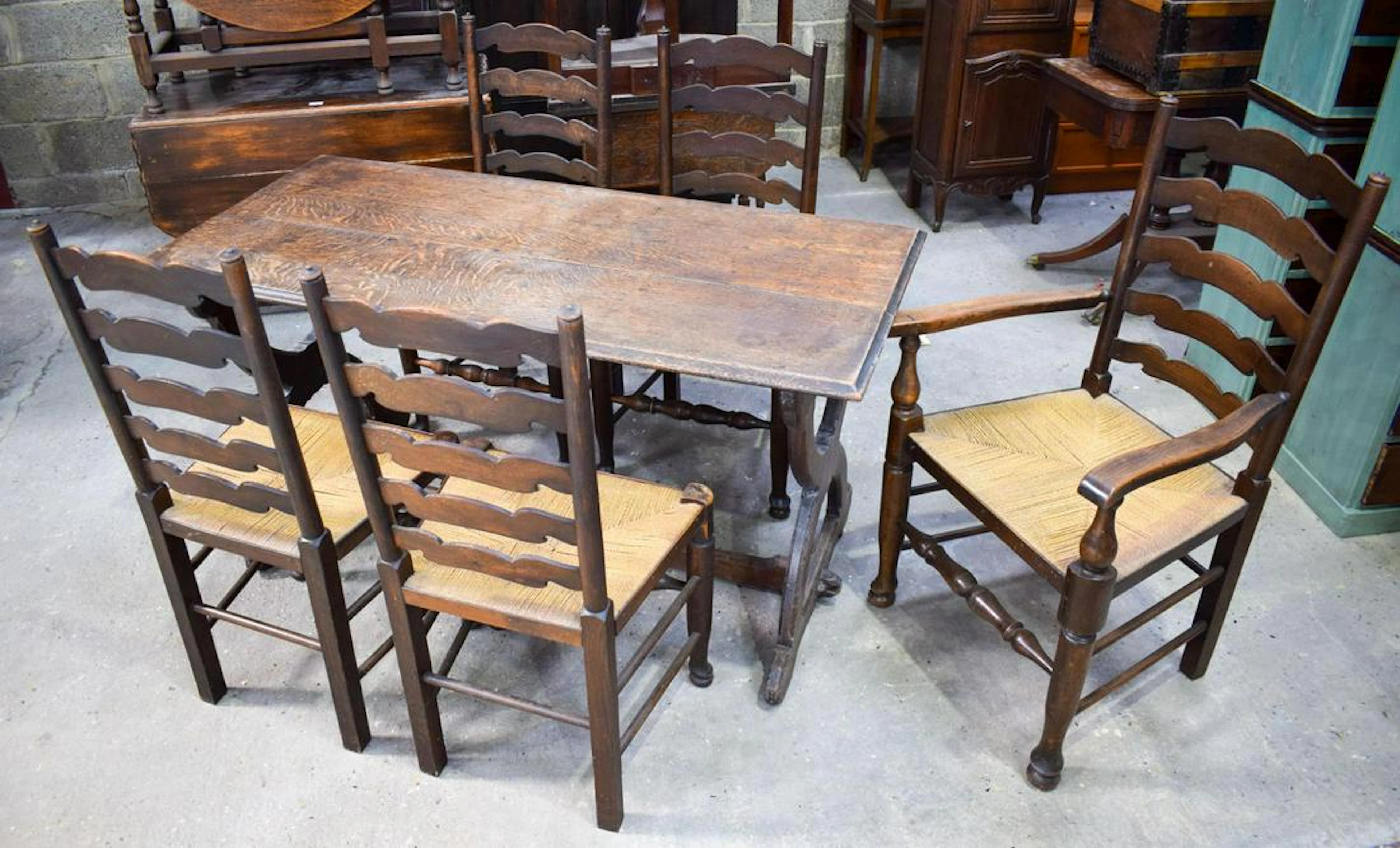 AN ERCOL STYLE DINING TABLE with five chairs