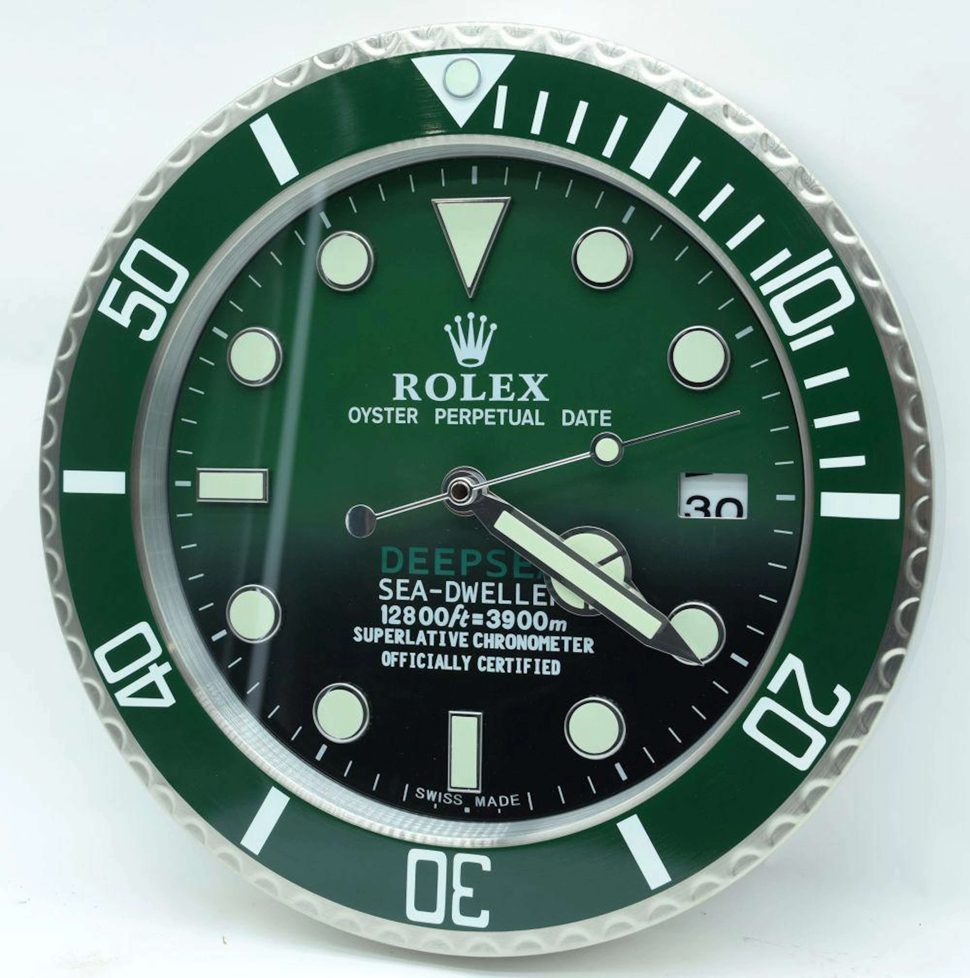 A contemporary Rolex type wall clock 34cm.