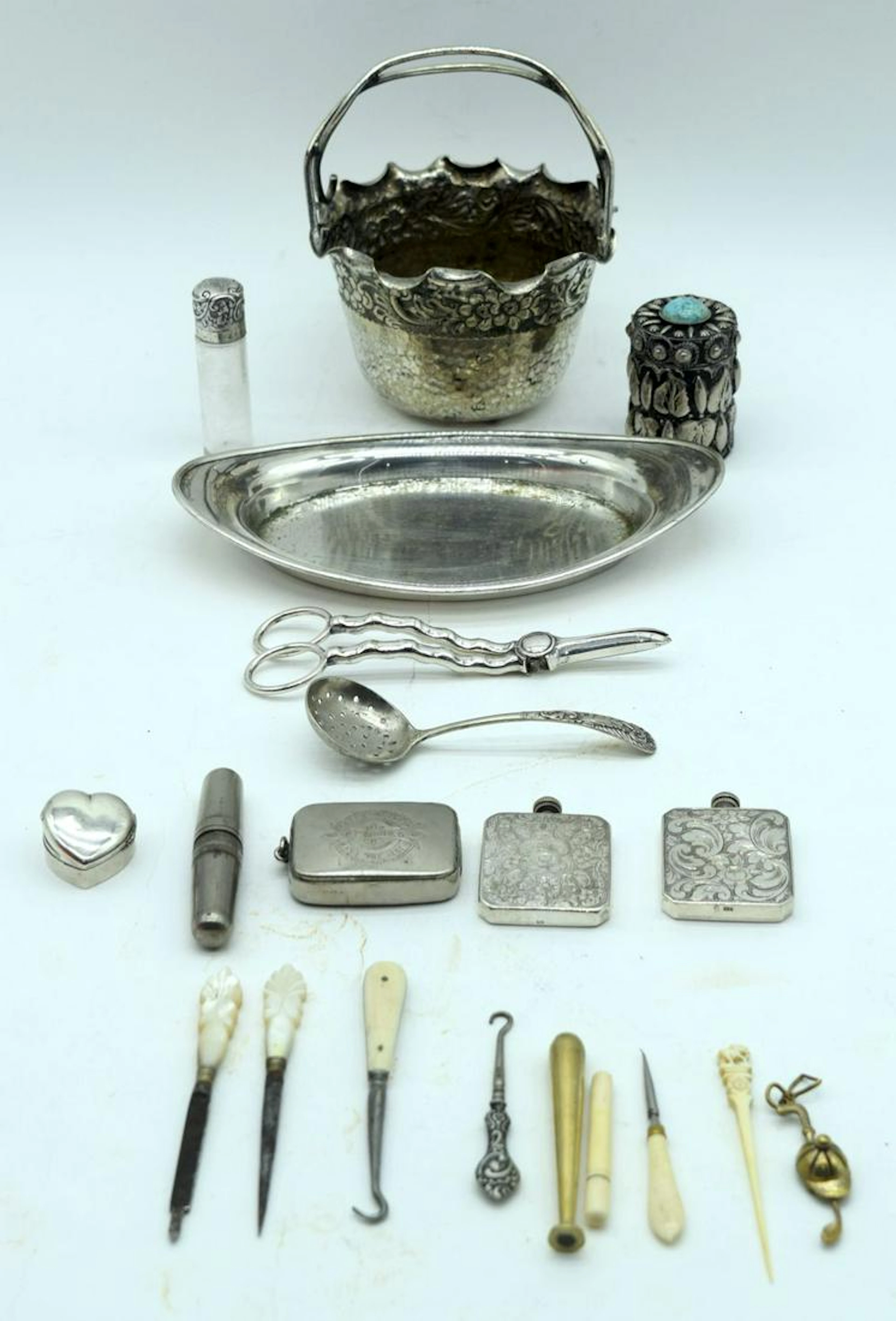 A small collection of Silver Perfume dispensers, vesta