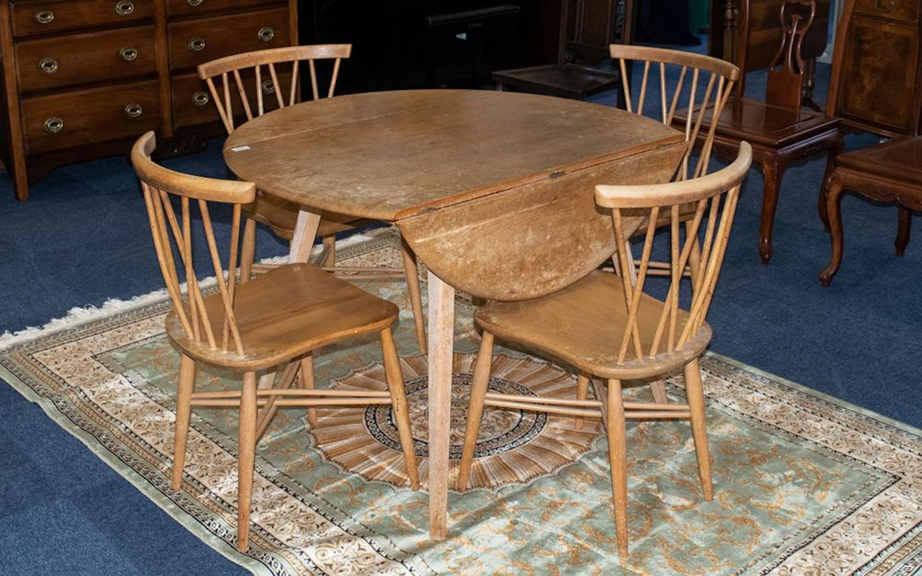 Ercol Table & Four Chairs. Chairs cross-banded style. Table has two side