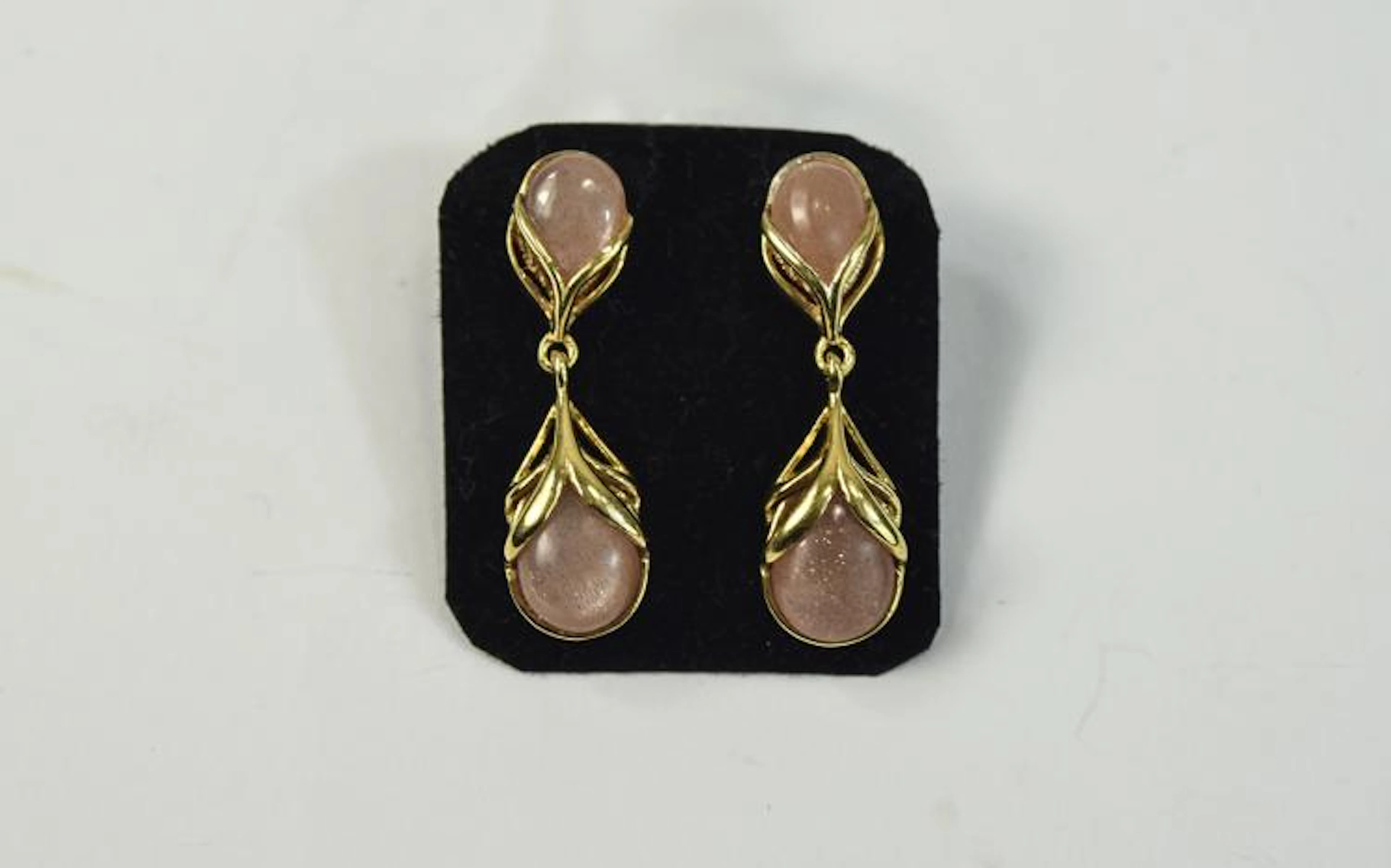 Peach Sunstone Pair of Drop Earrings, a pear cut cabochon in an openwork se