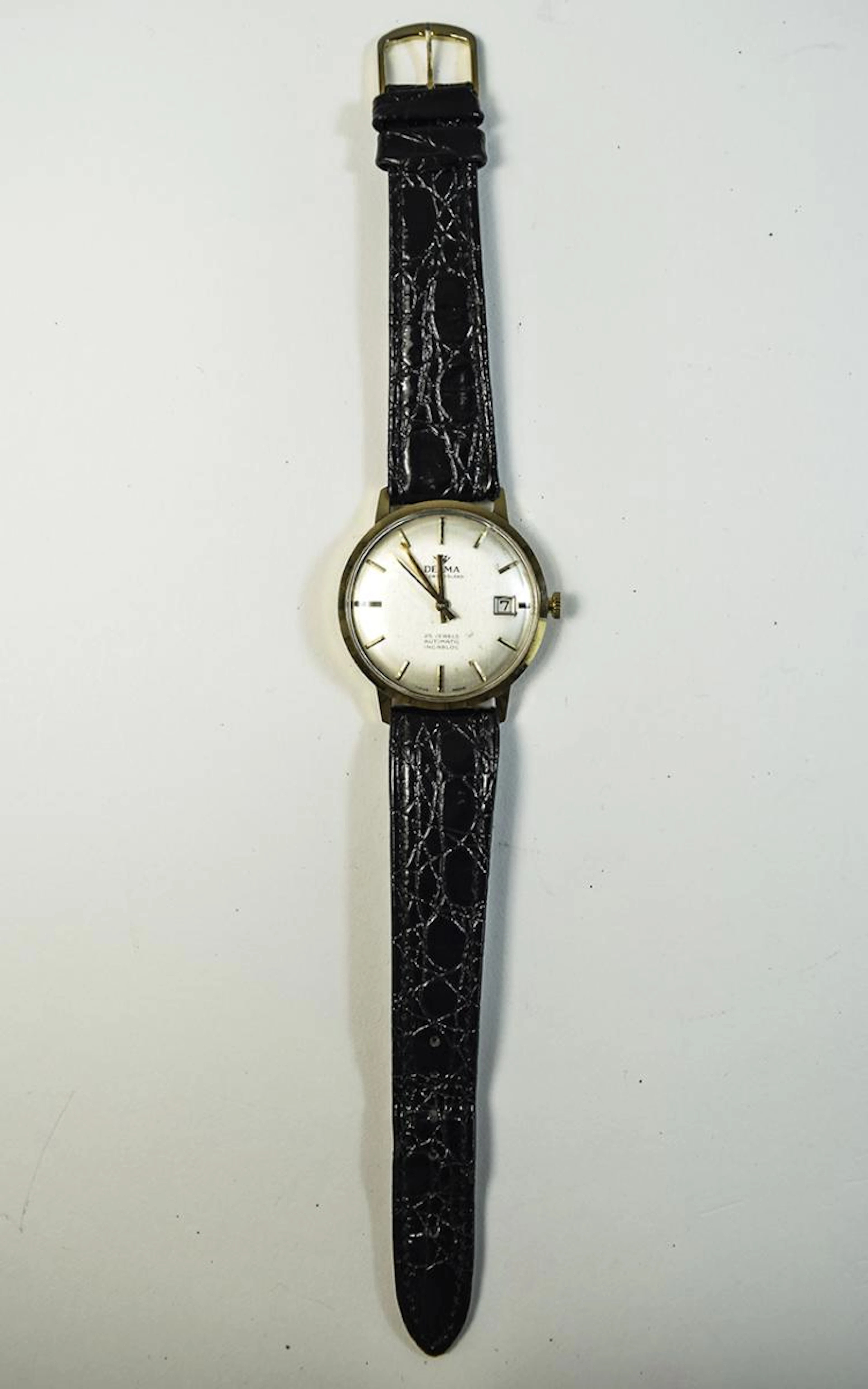 Gents Delma Gold Watch Delma Watch with 9ct gold case. Silver coloured dial