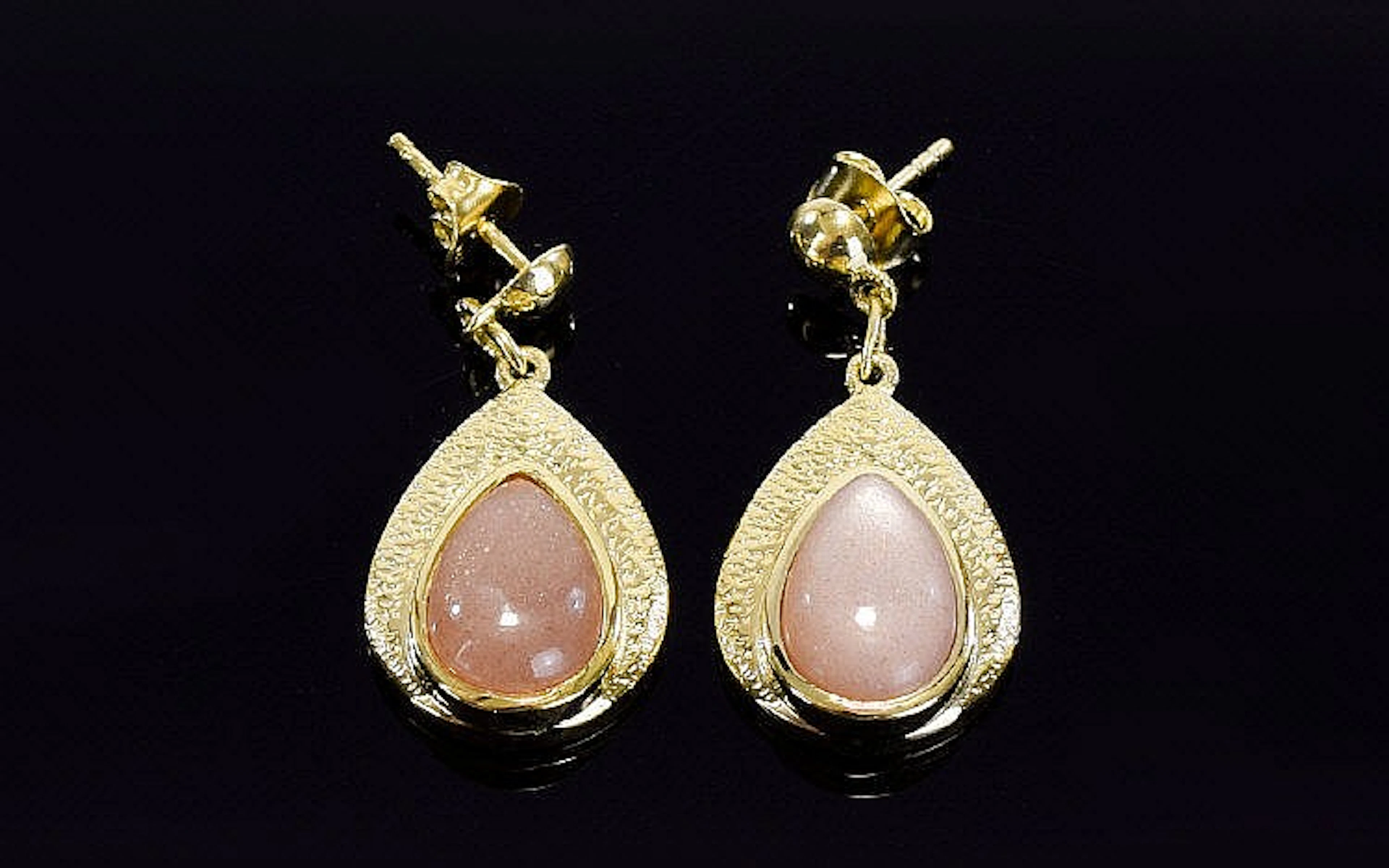 Peach Sunstone Drop Earrings, each earring comprising a 3ct pear cut sunsto