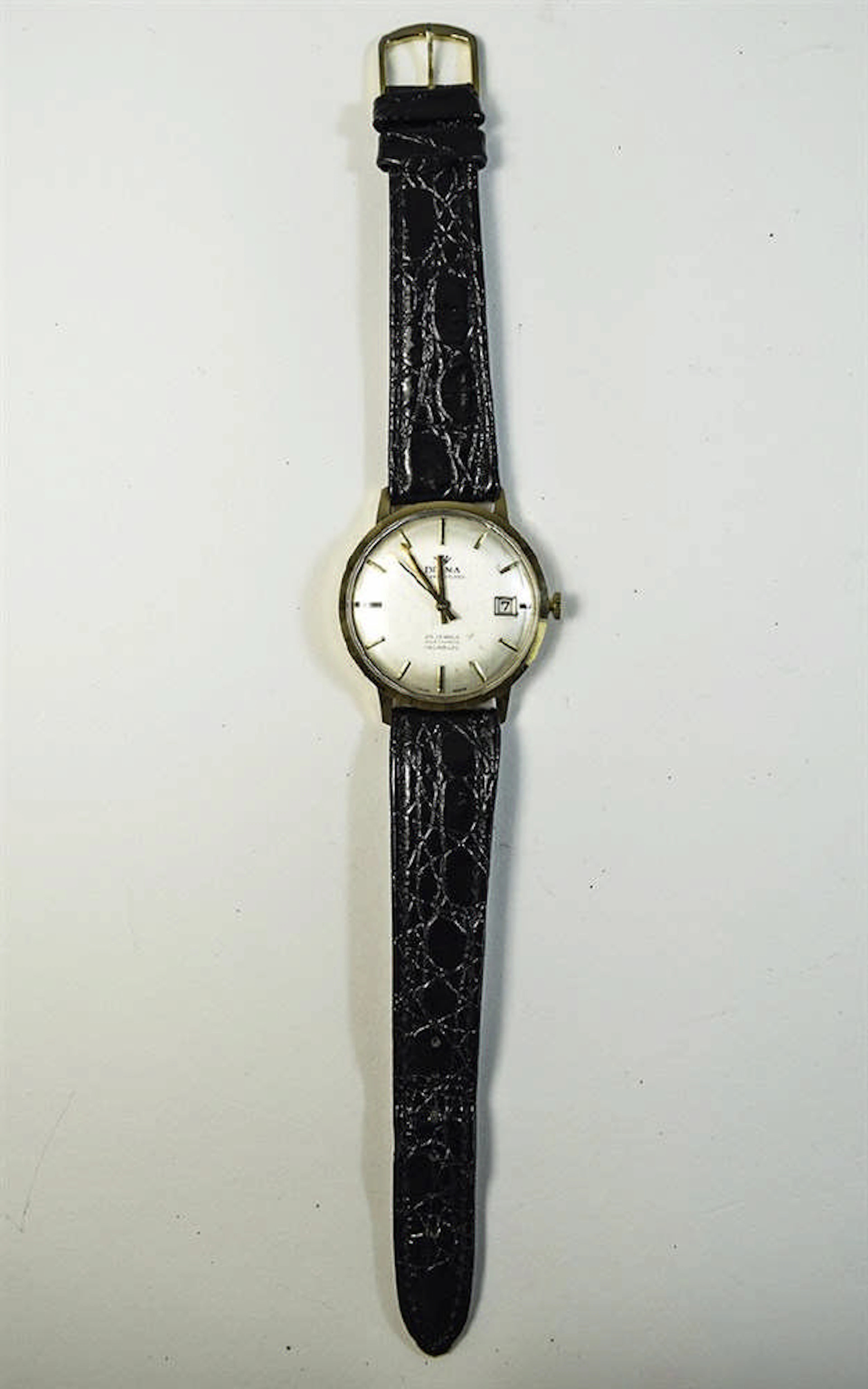 Gents Delma Gold Watch Delma Watch with 9ct gold case. Silver coloured dial
