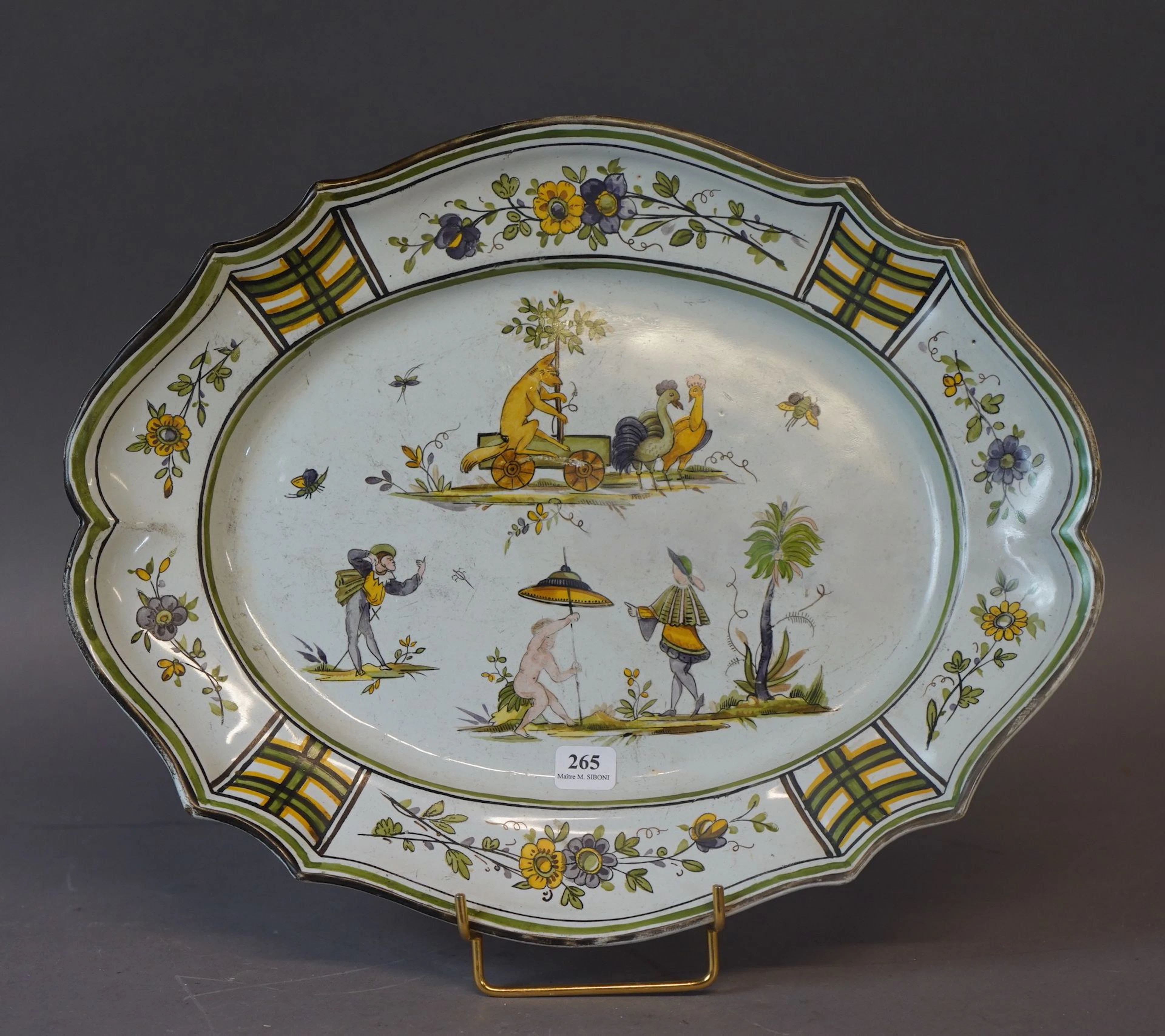 265- Plat en faïence à décor de personnages,... - Lot 265 - Siboni