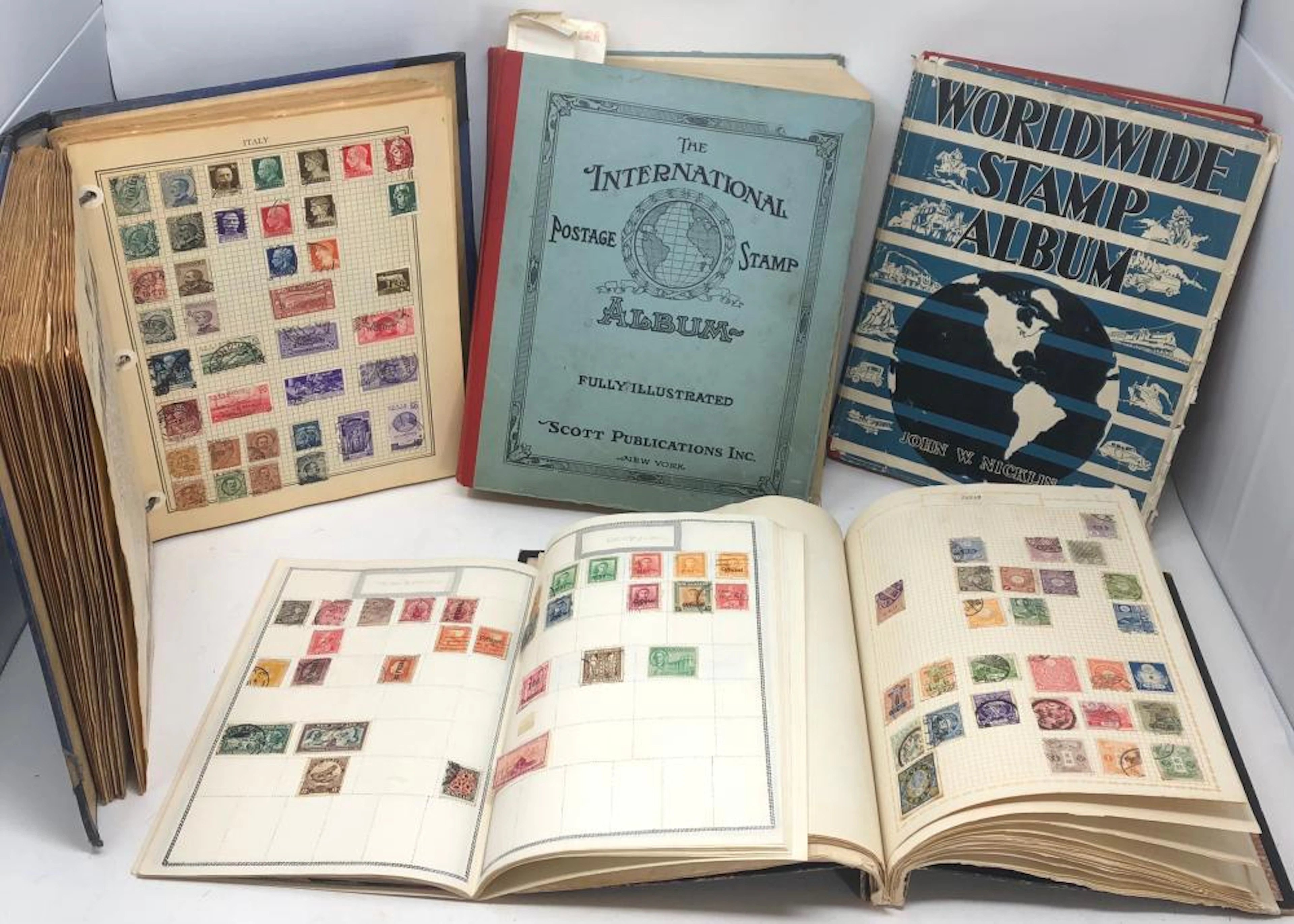 International vintage world stamp collection in four volume.