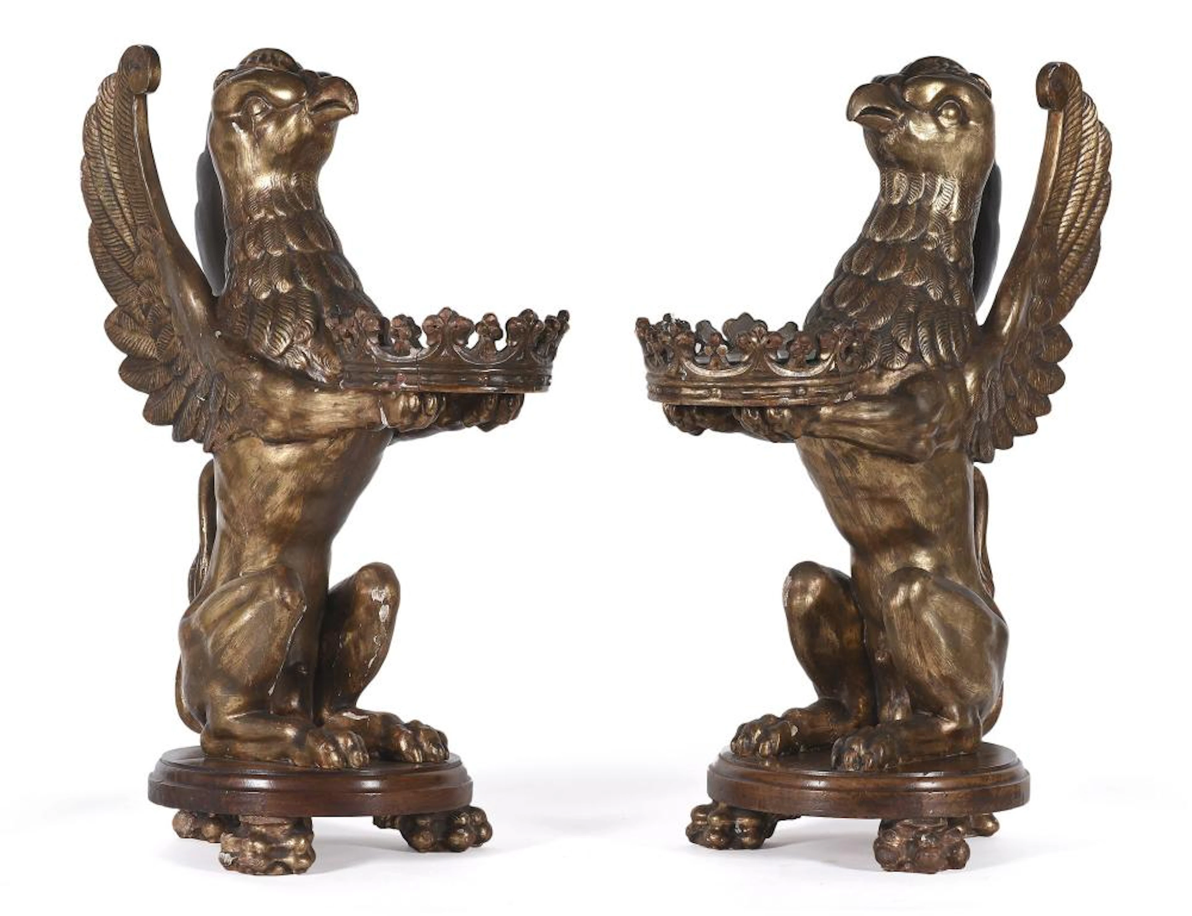 Pareja de figuras realizadas en madera tallada y dorada...