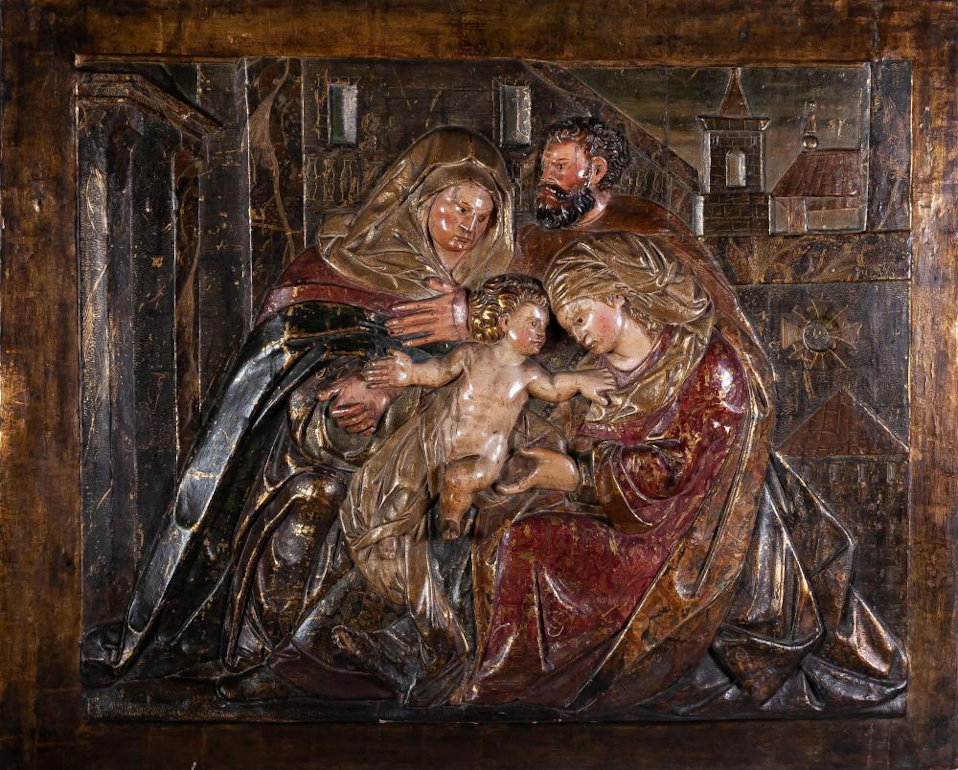 A Castilian carved panel of 'The Holy Family with Saint Anne', c.1600