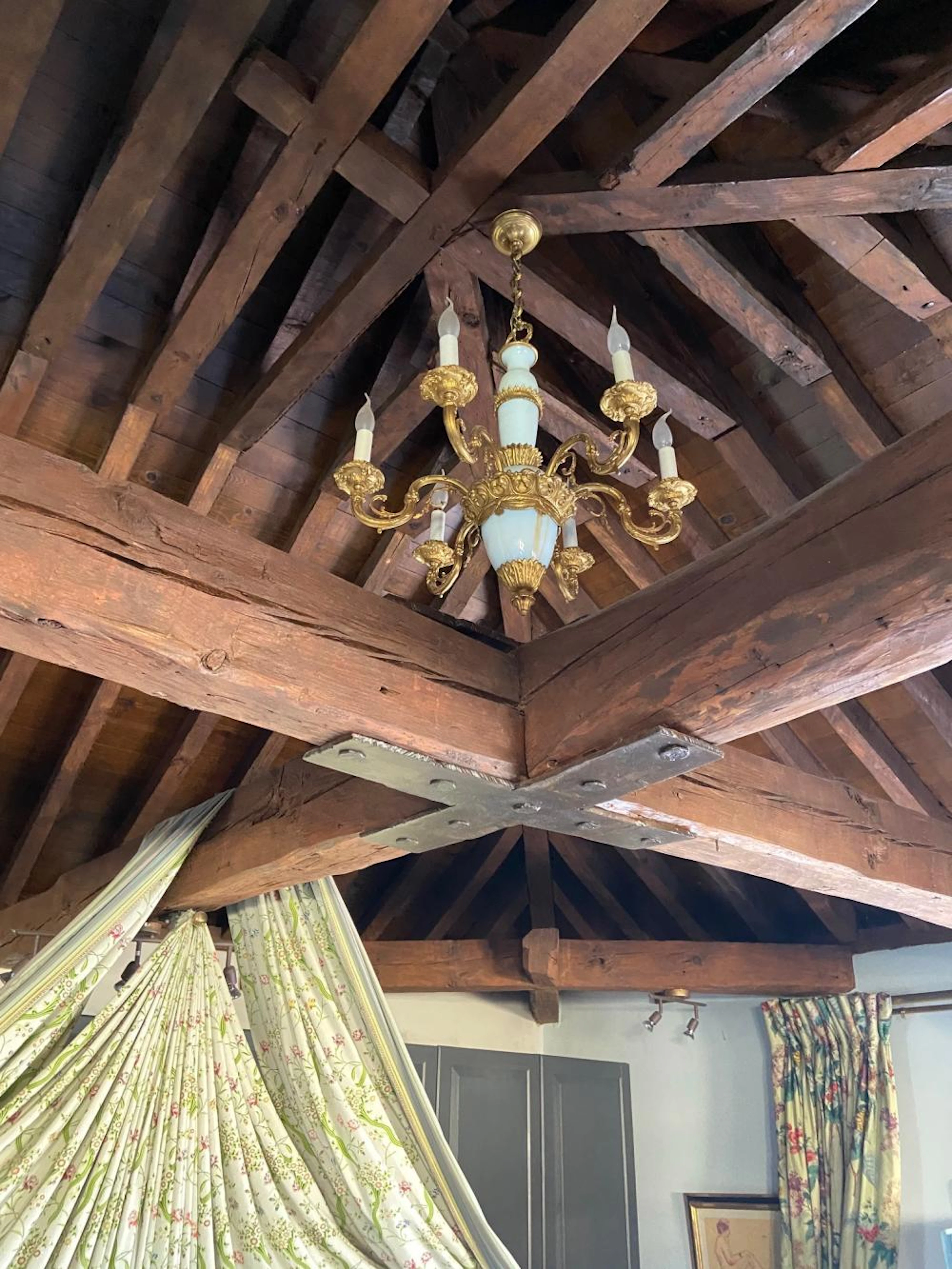A gilt-bronze and white opaline glass six-light chandelier