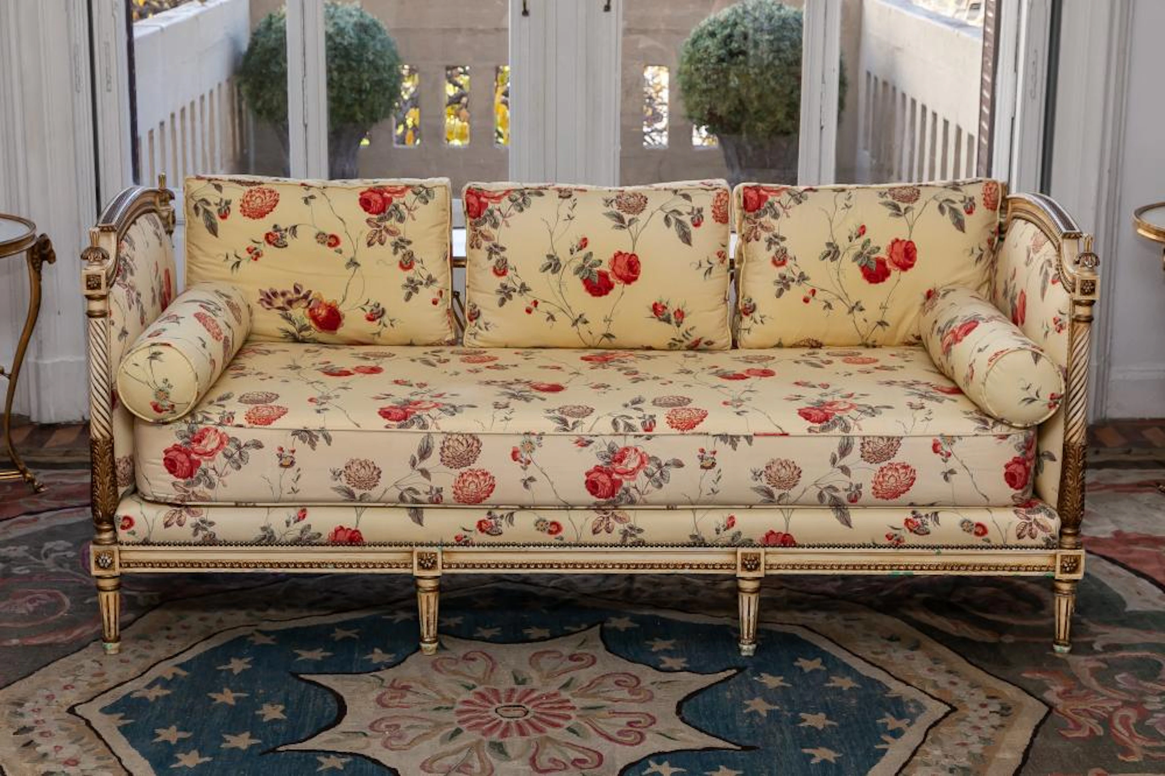 A Louis XVI style carved lacquered daybed