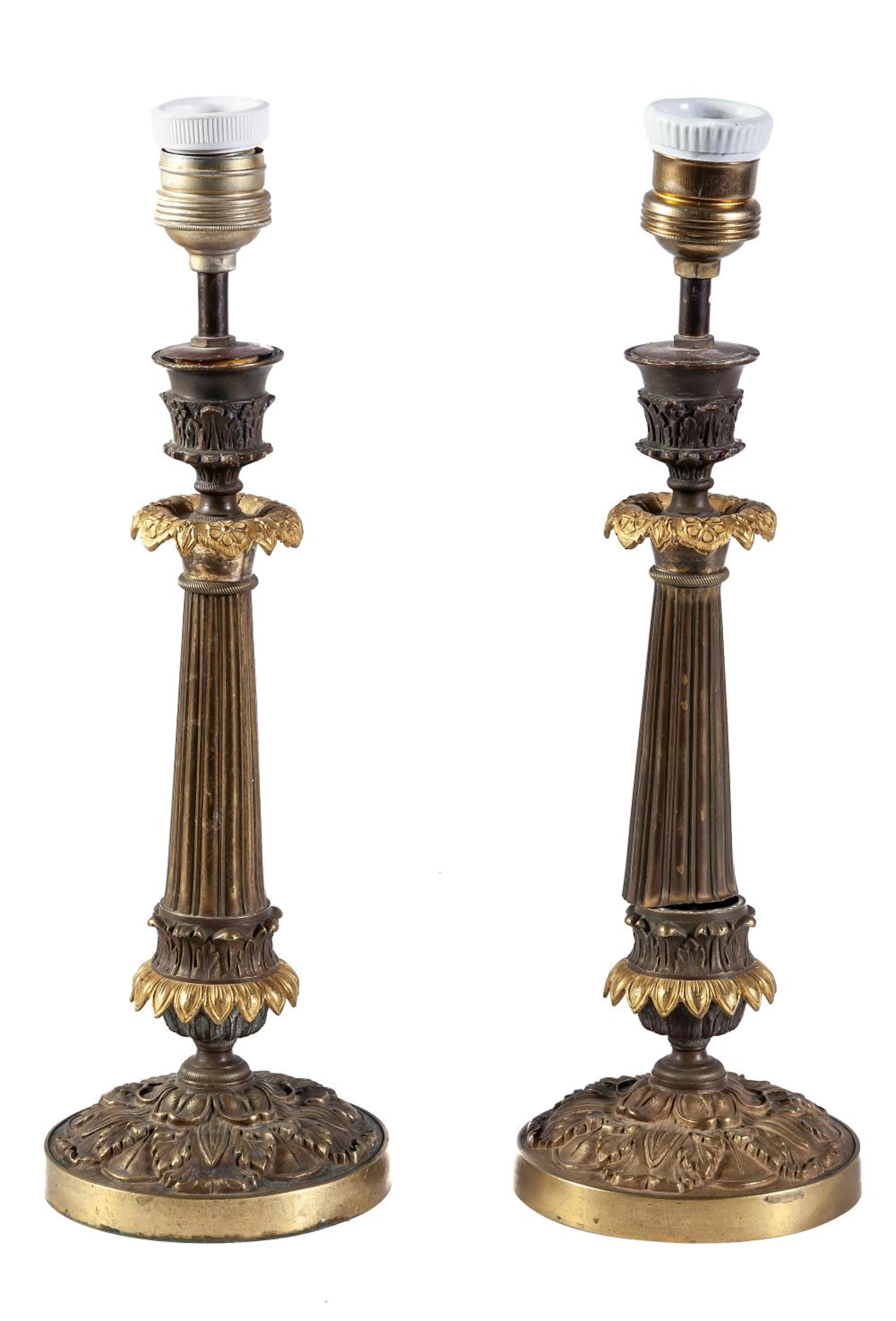 A pair of gilt bronze candlesticks converted to lamps