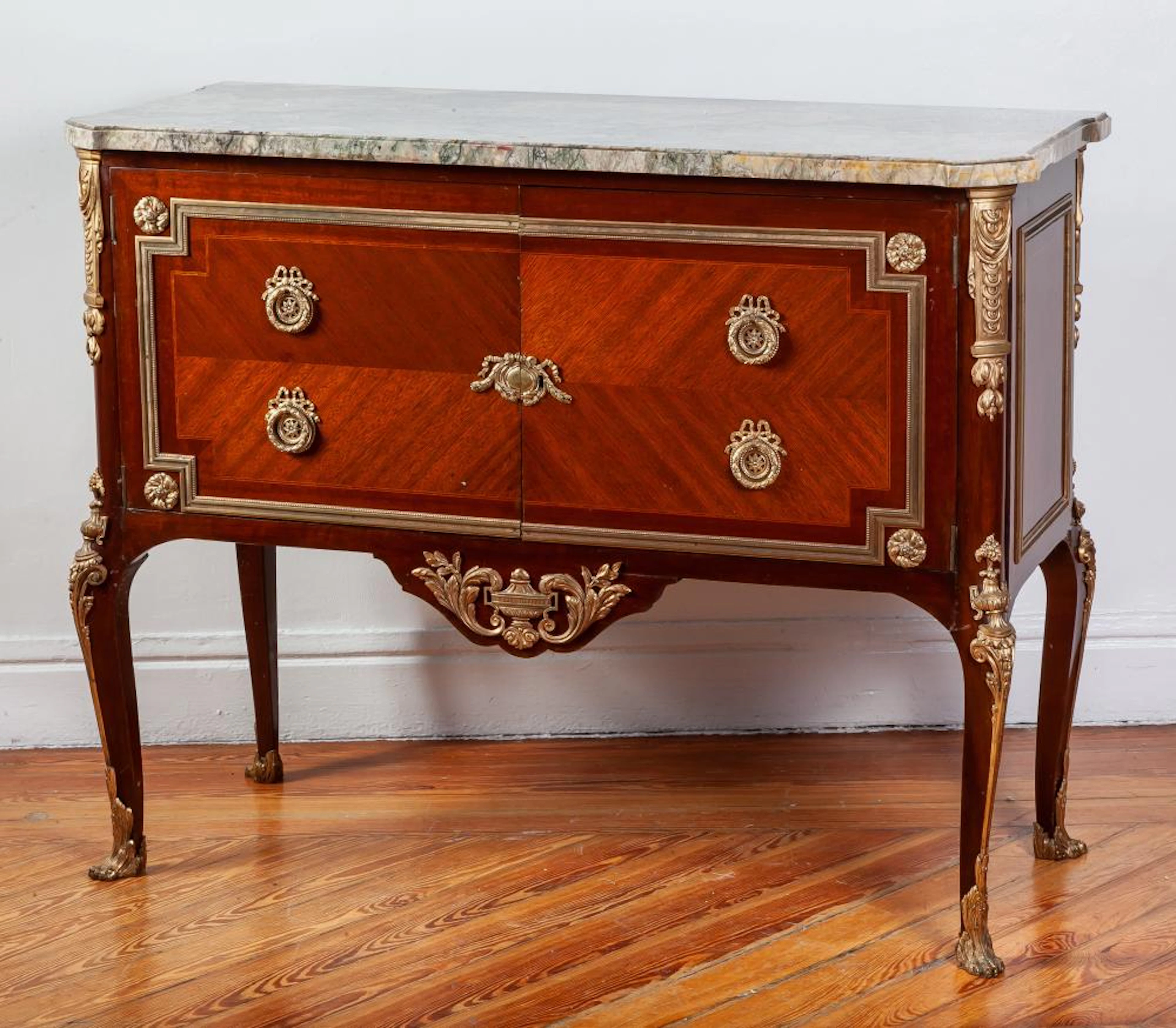 A Transitional Louis XV / Louis XVI style mahogany commode, 20th Century