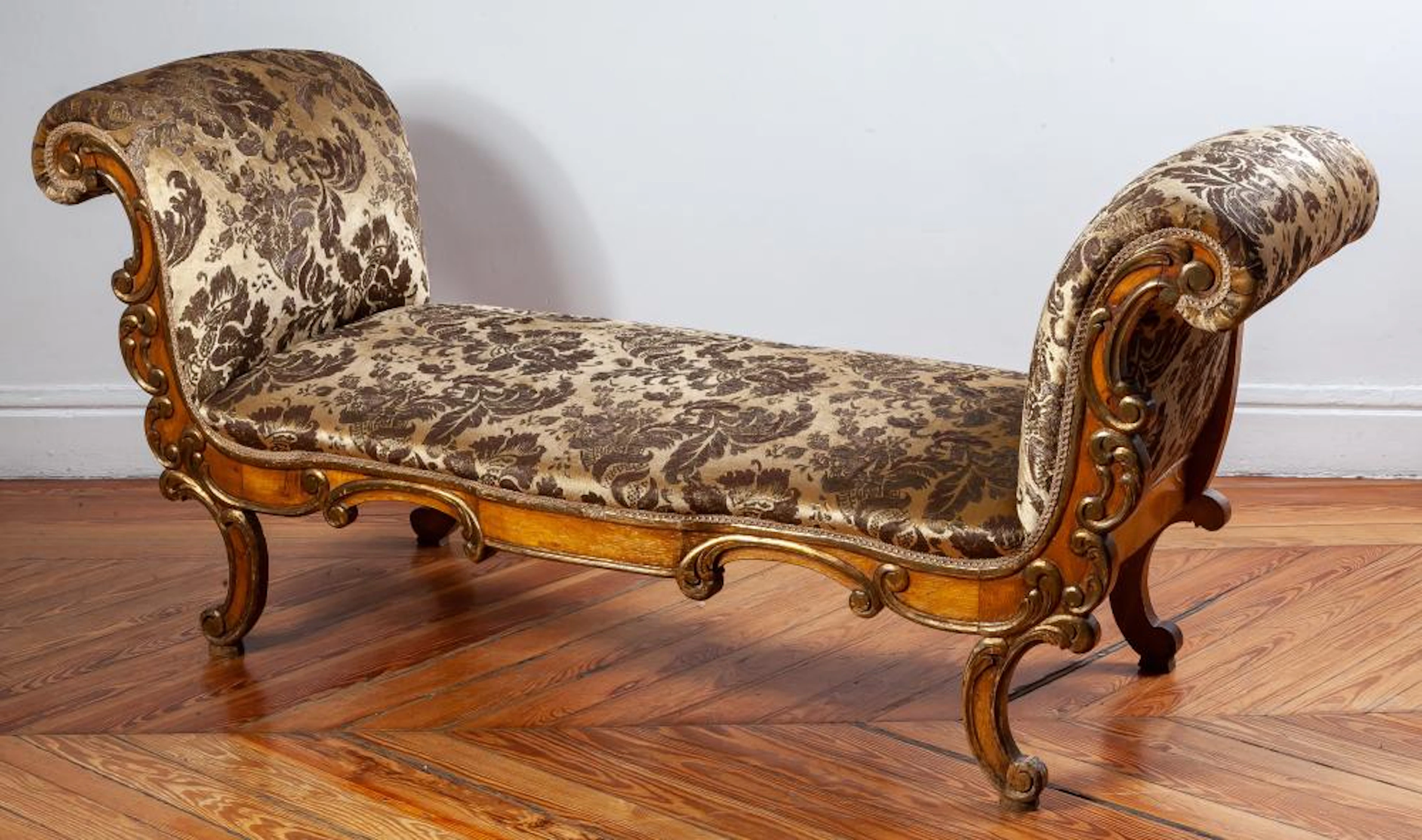 A green velvet-upholstered and parcel-gilt bench, 20th Century