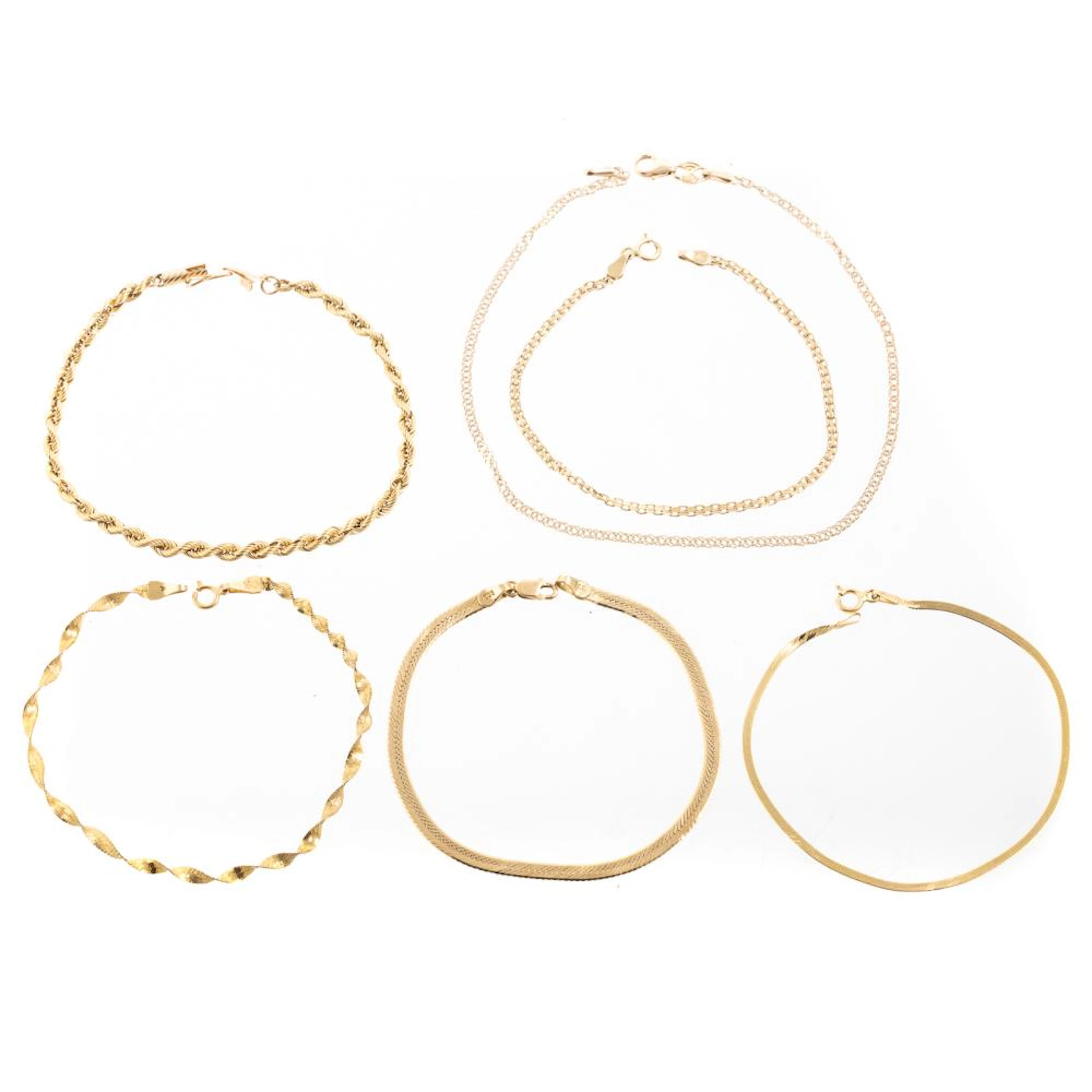 A Collection of Chain Bracelets & an Anklet in 14K