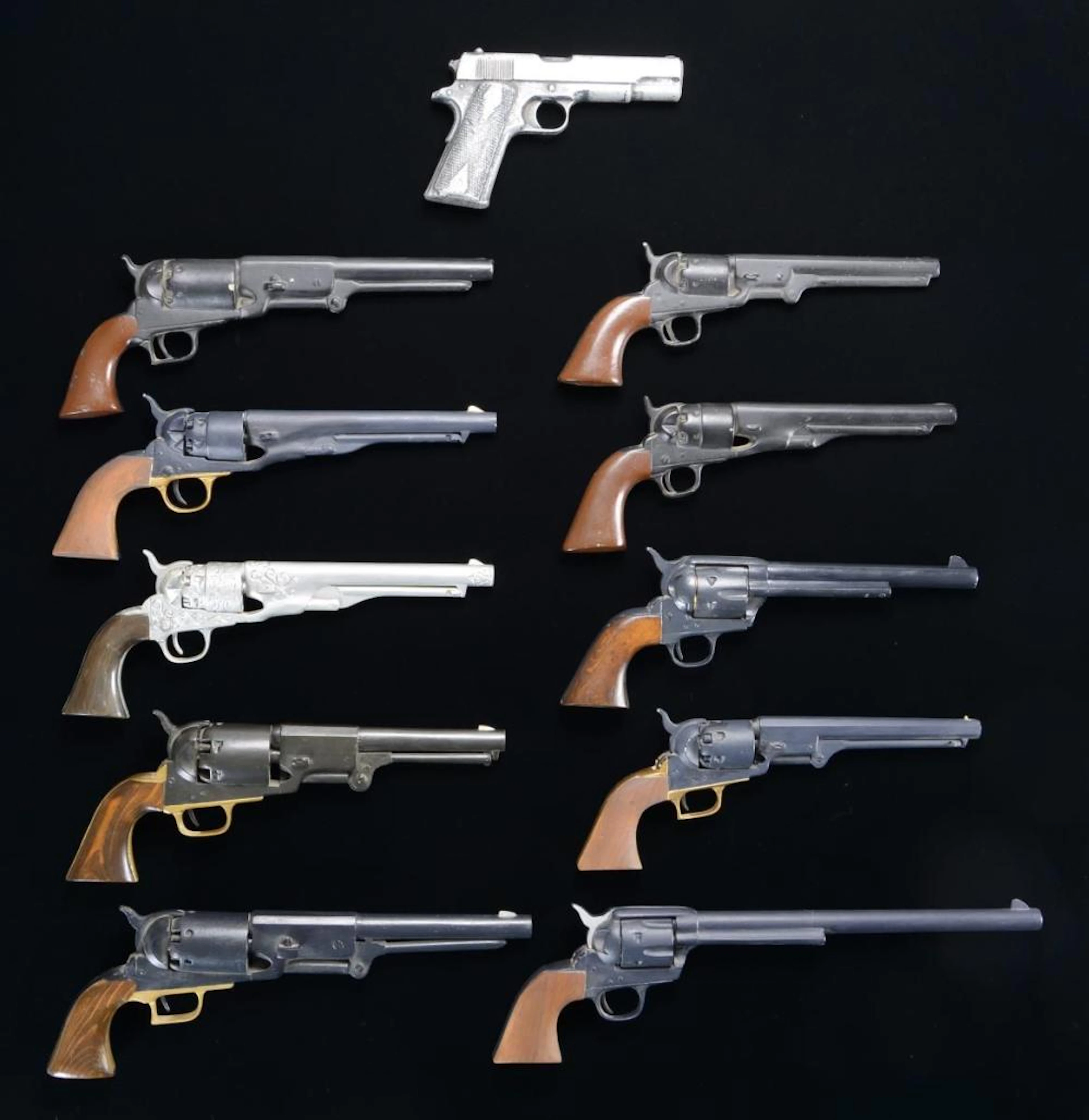 10 CARVED & PROP EARLY REVOLVERS & 1 PROP M1911
