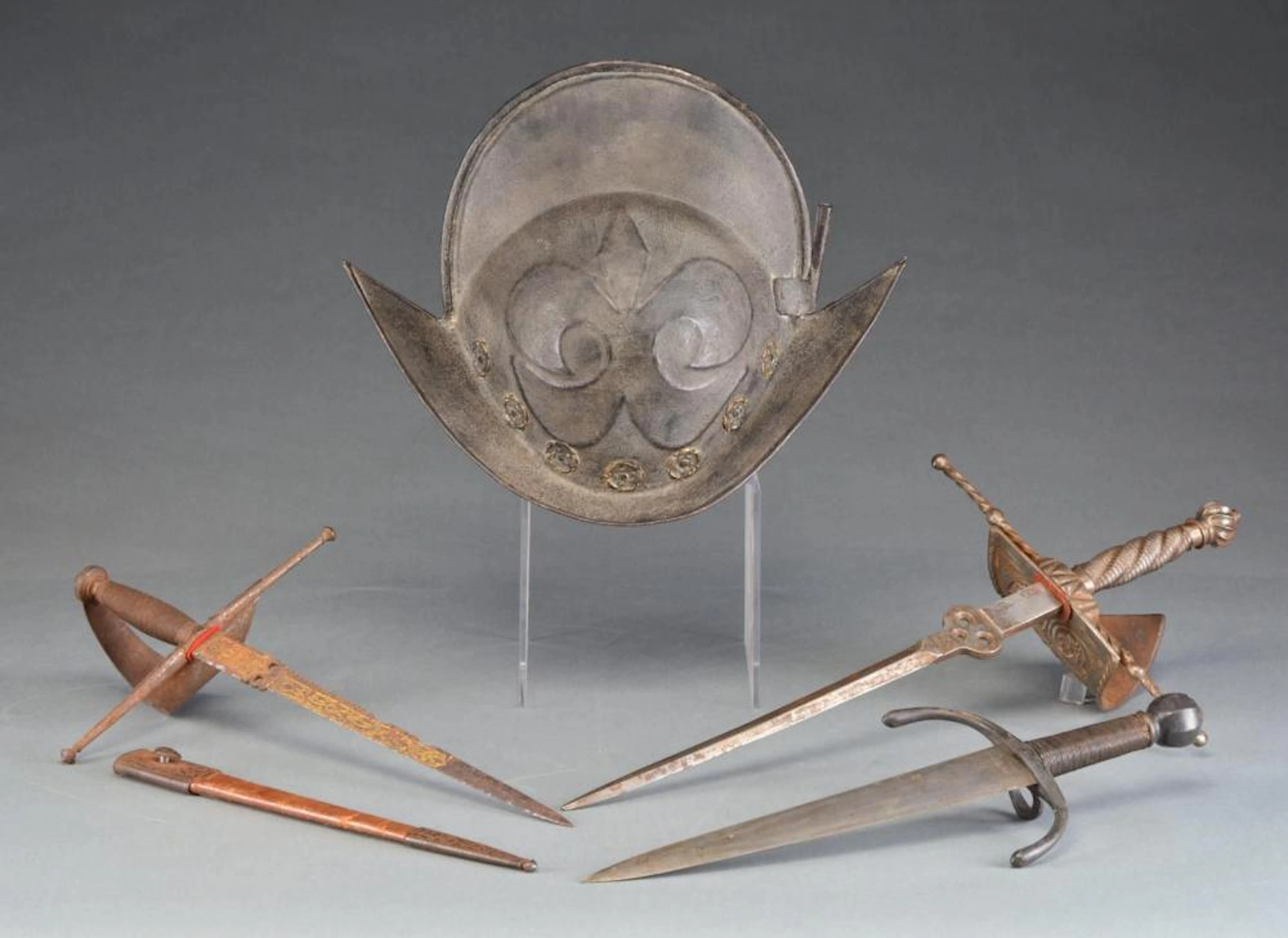 MORION HELMET & 3 LEFT HAND STYLE DAGGERS.