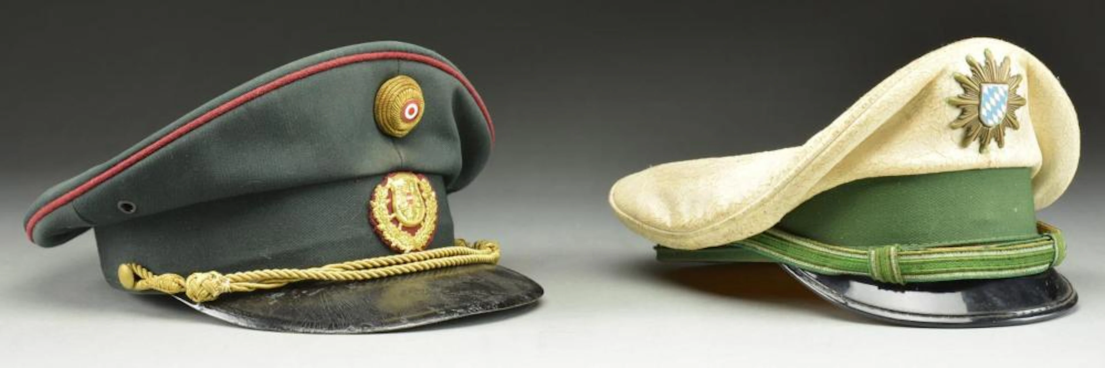 2 GERMAN VISOR CAPS FROM THE WWI TO WWII ERA.