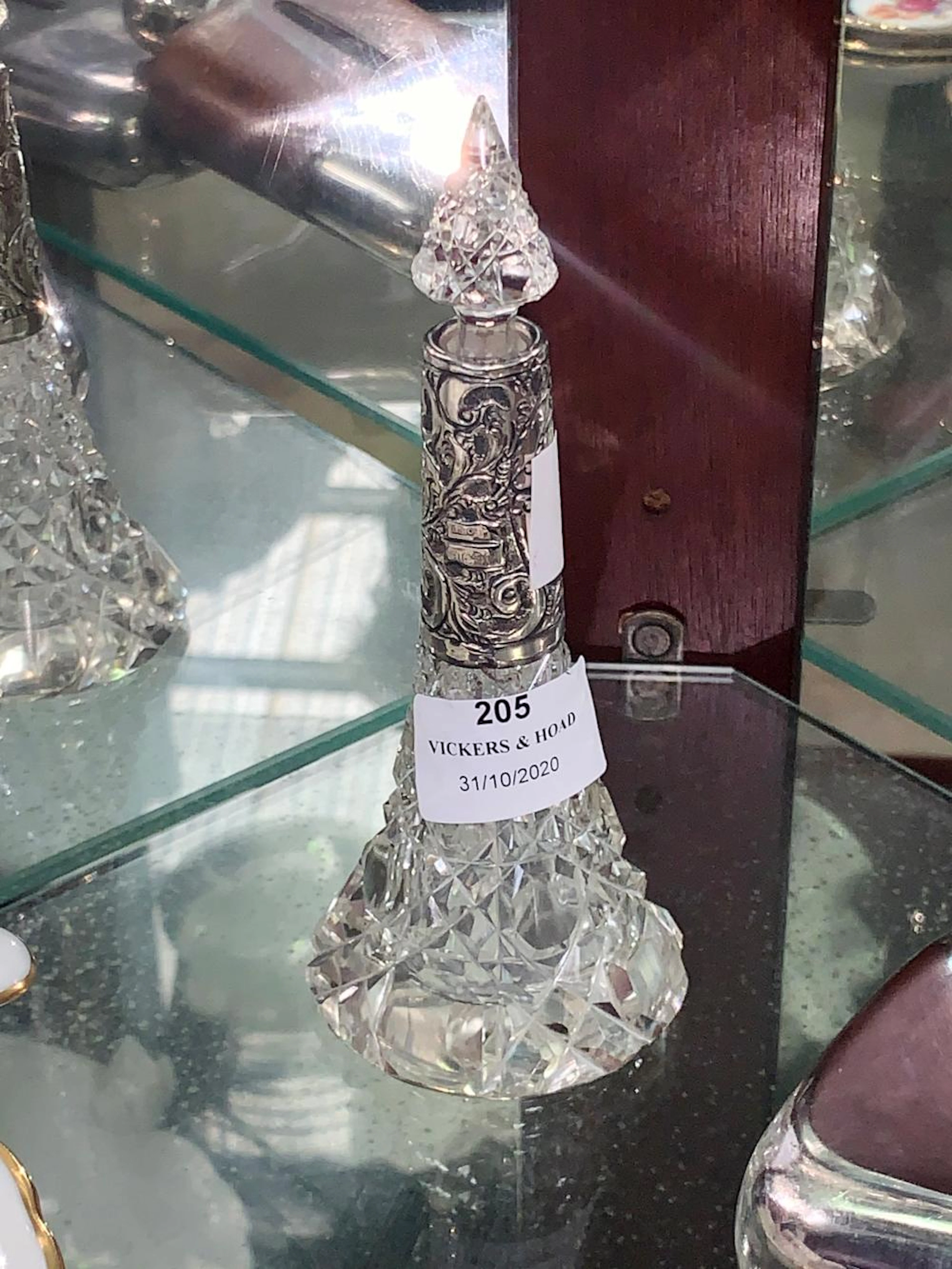 Antique cut crystal perfume bottle with silver collar