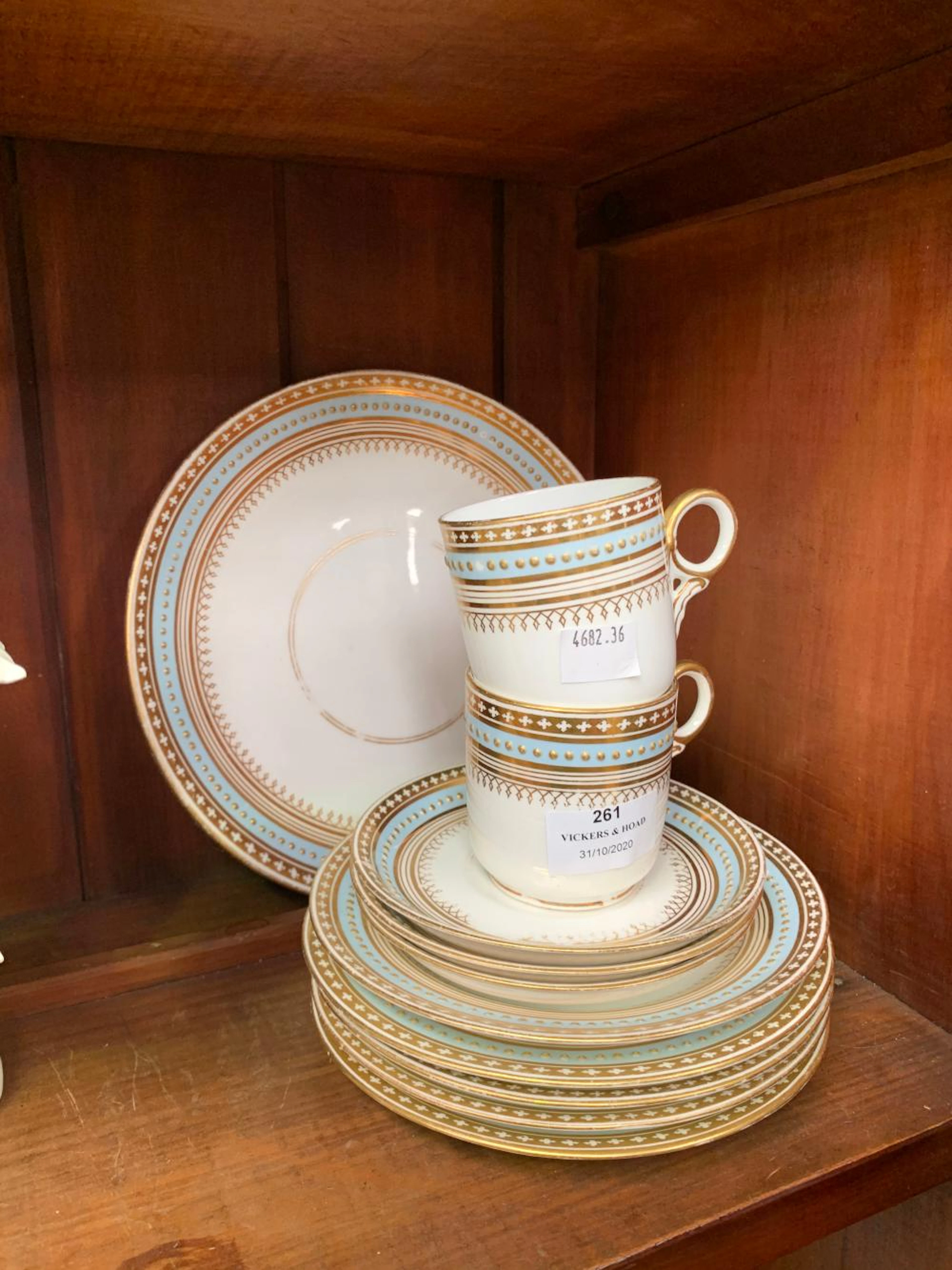 Antique part service to include cups, saucers and plates