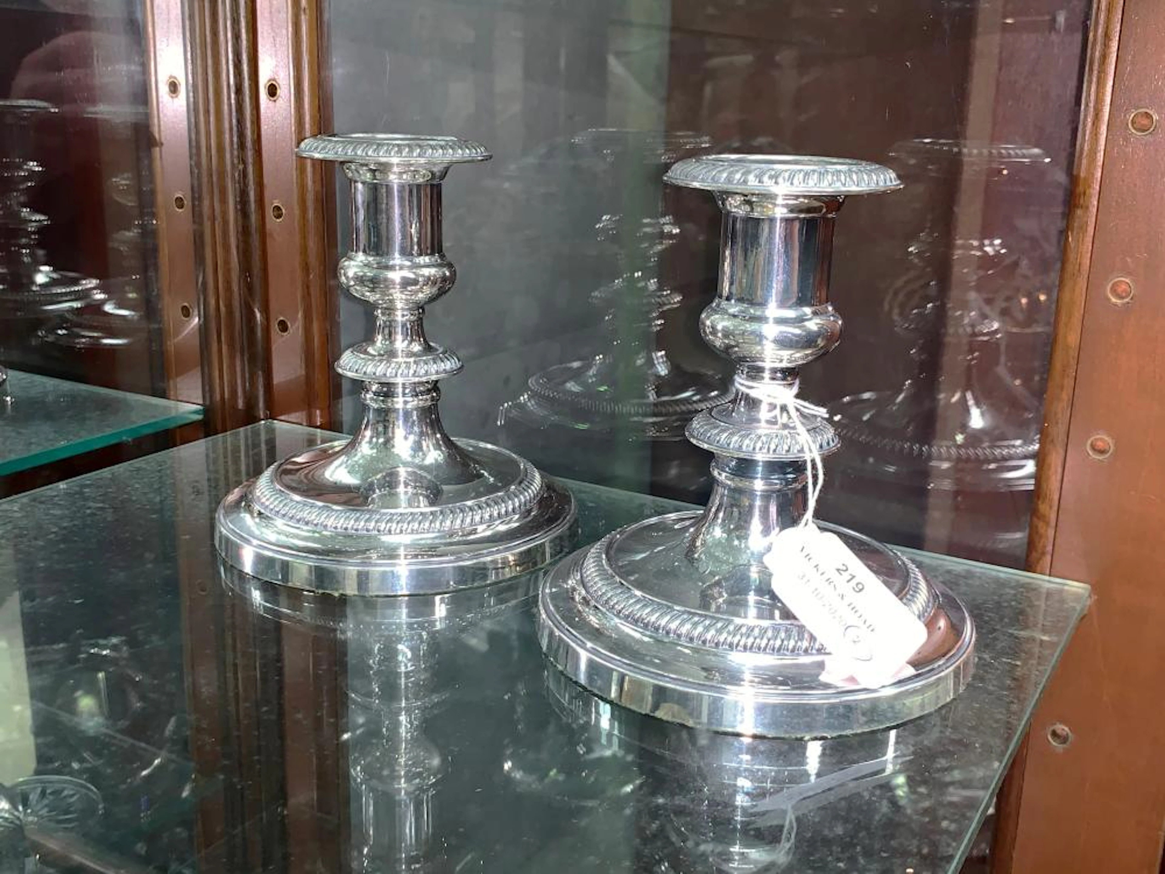 Pair of Baker Ellis squat form silver plate candlesticks