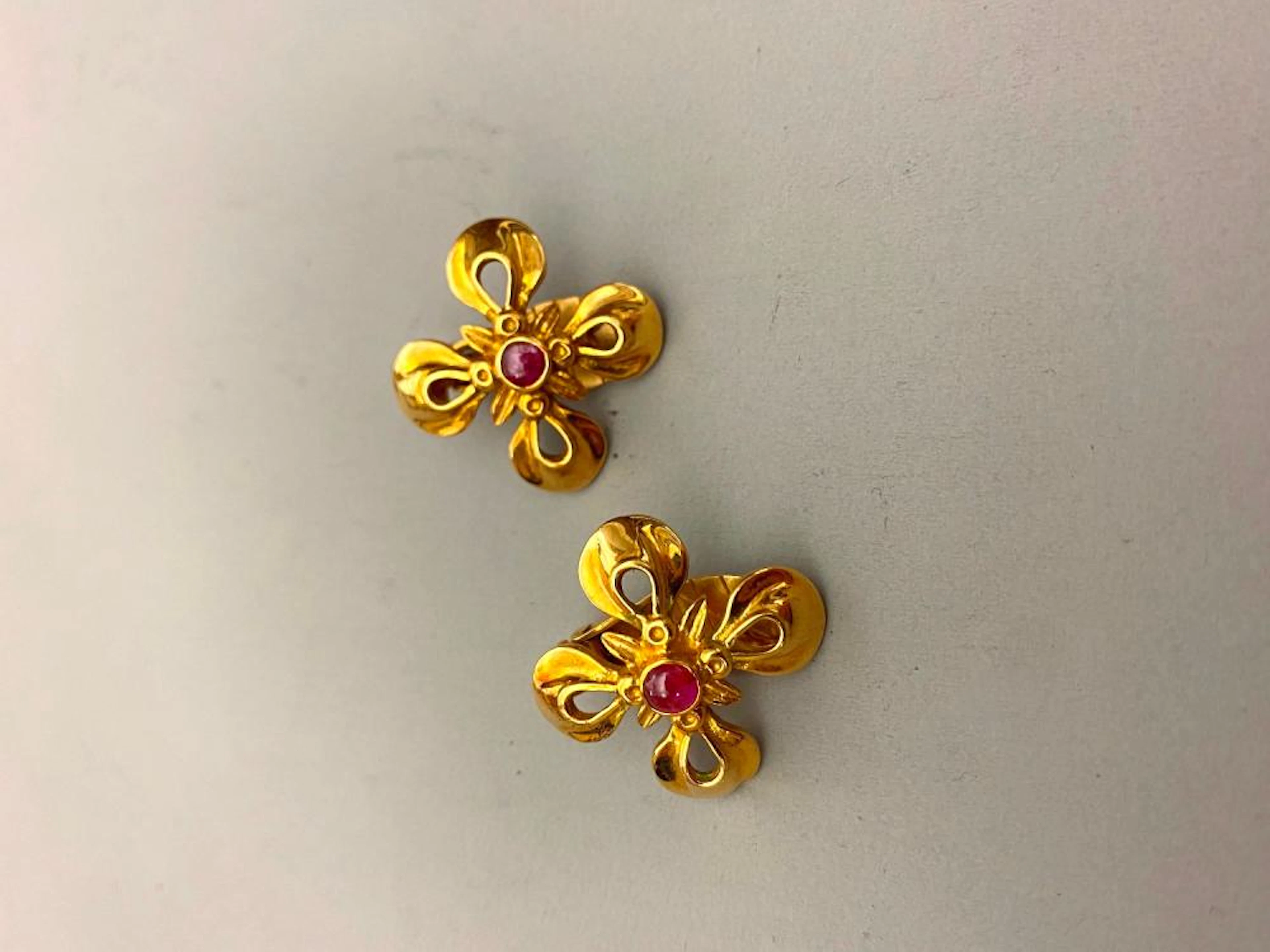 PAIR SIGNED LALOUNIS 18K (750) YELLOW GOLD AND RUBY...