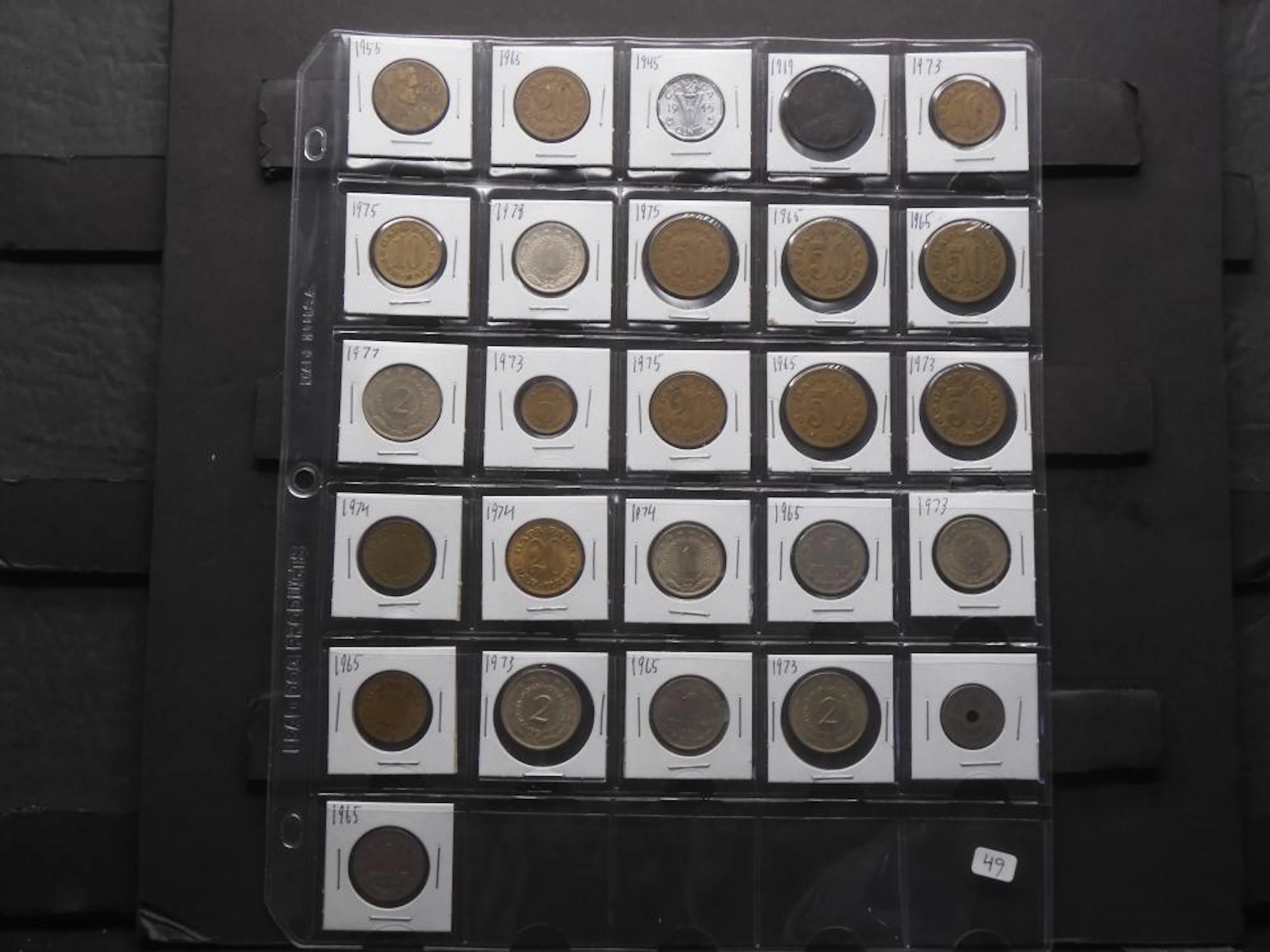 Page of Old Canada and Yugoslavia coins