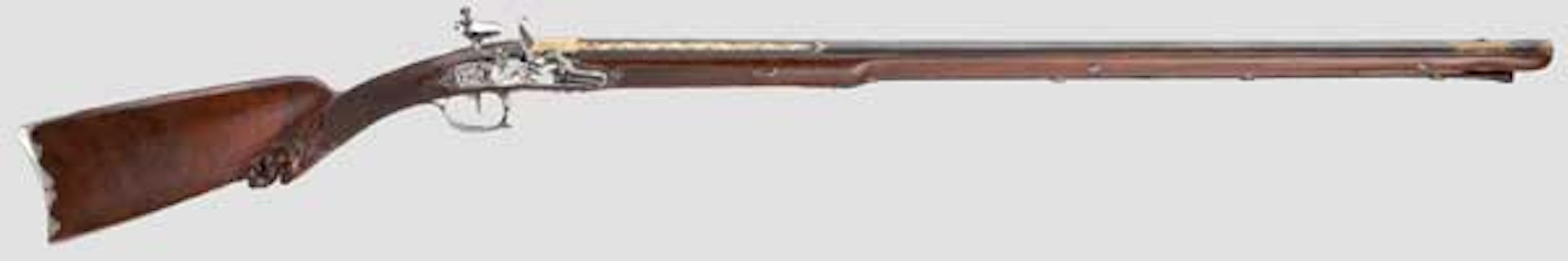 A very fine French silver-mounted and gold-inlaid flintlock shotgun