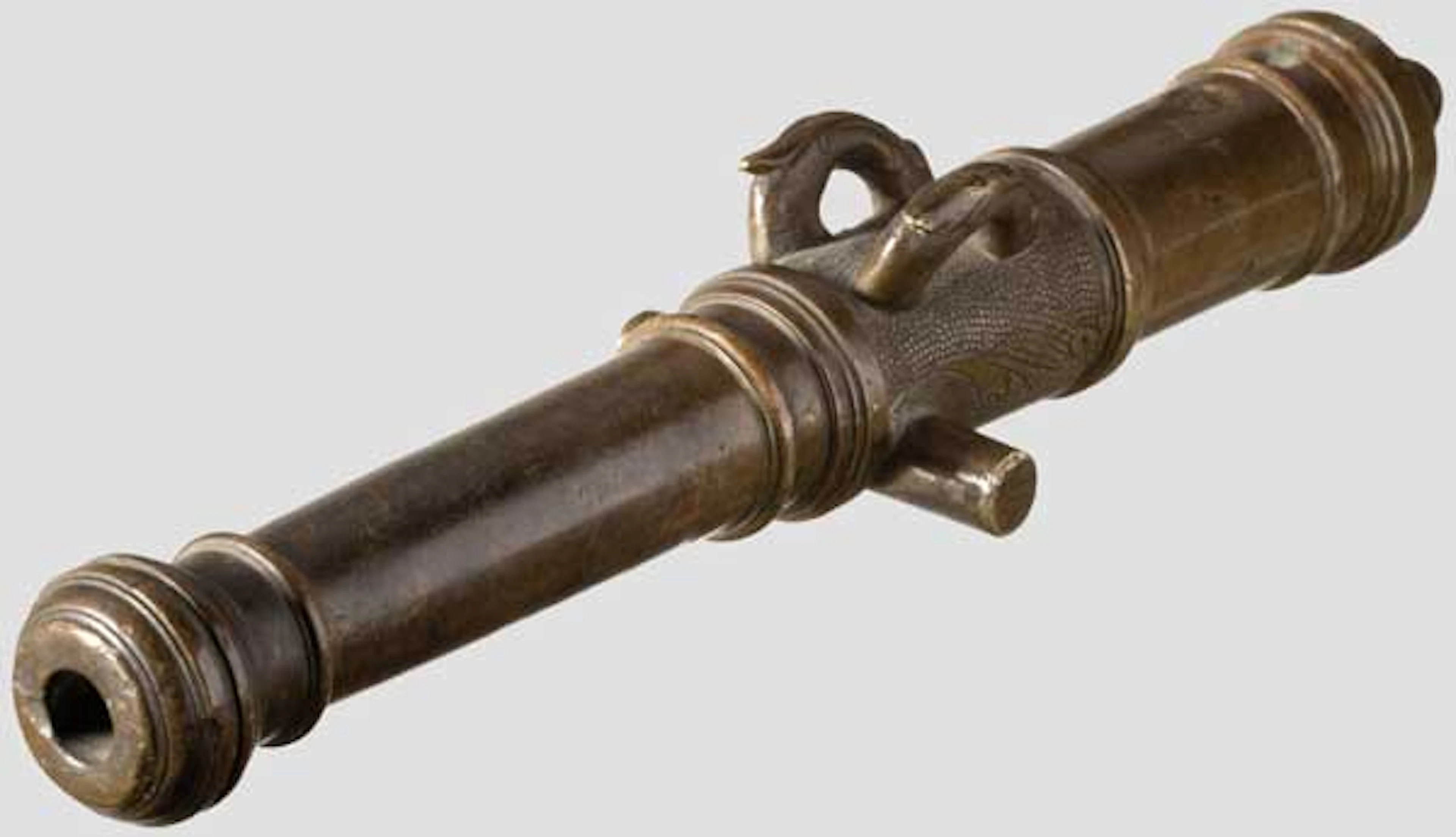A bronze model cannon barrel