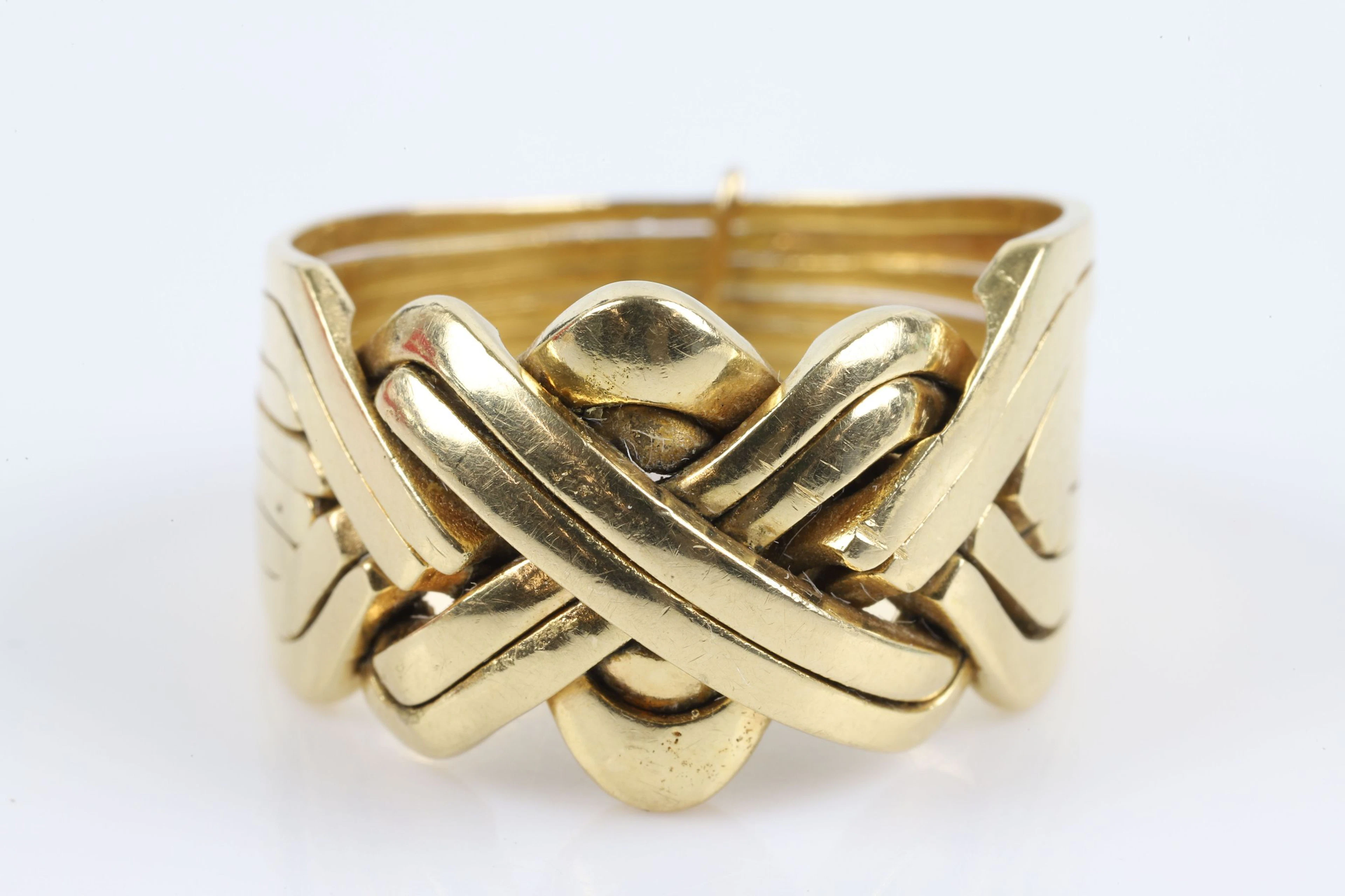 PUSSELRING, åttadelad, guld, 18 k, ca 15,0 g, Pavia, Italien