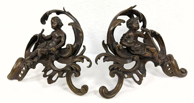 Pr Bronze Chenets Cherub Forms. Brown patina. Andirons.