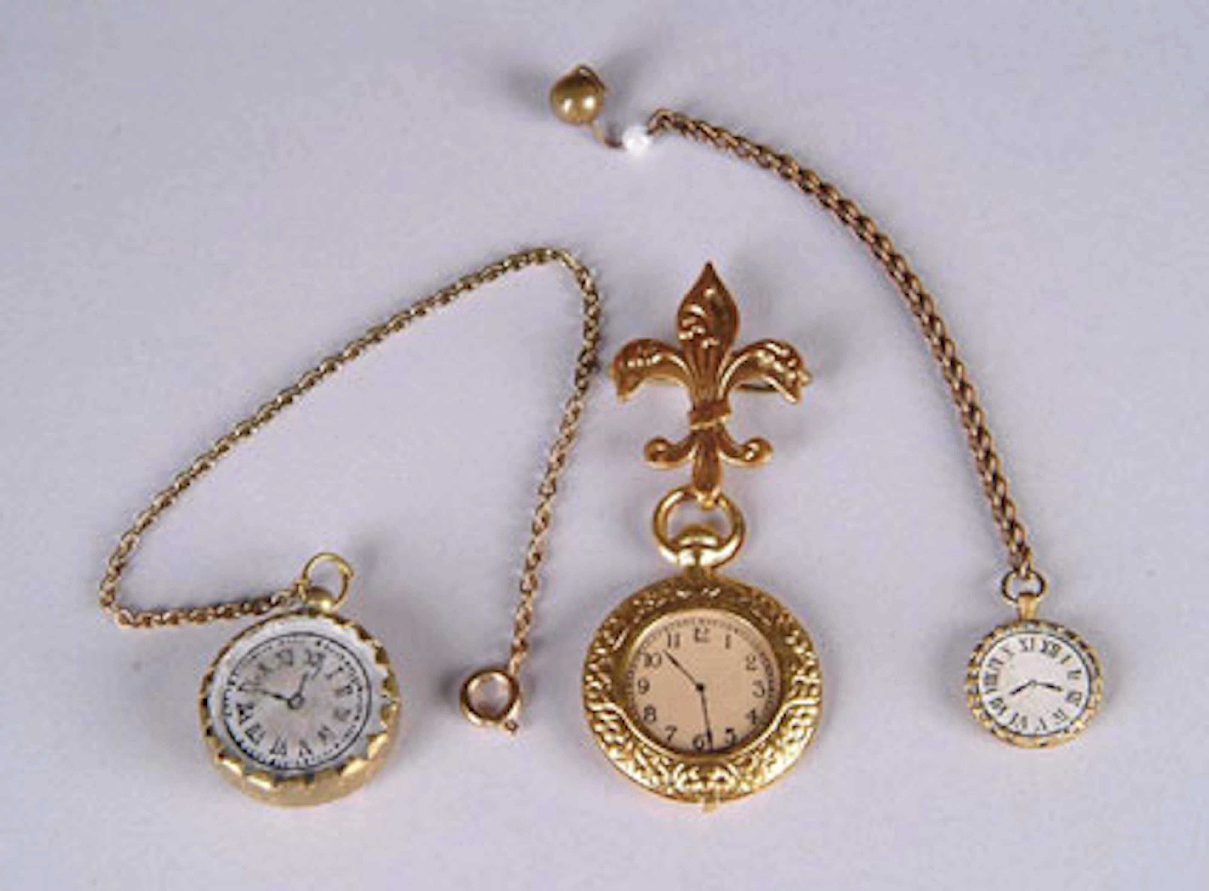 COLLECTION OF THREE DOLL WATCHES
