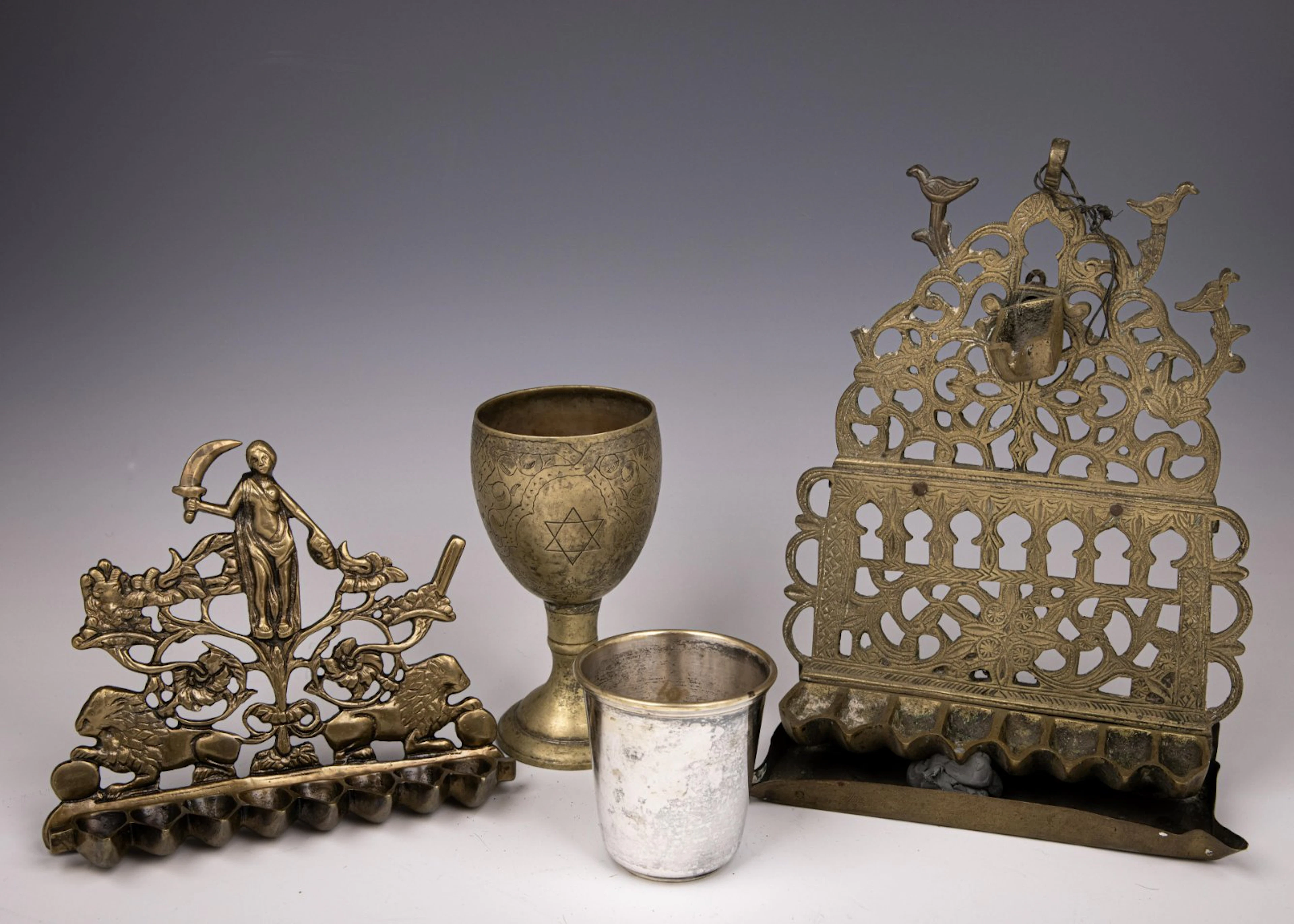 TWO BRASS HANUKKAH LAMPS AND TWO BRASS KIDDUSH CUPS