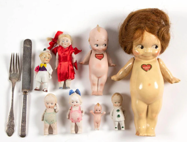 ASSORTED MATERIALS DOLLS AND CHILDREN'S ARTICLES, LOT OF TEN