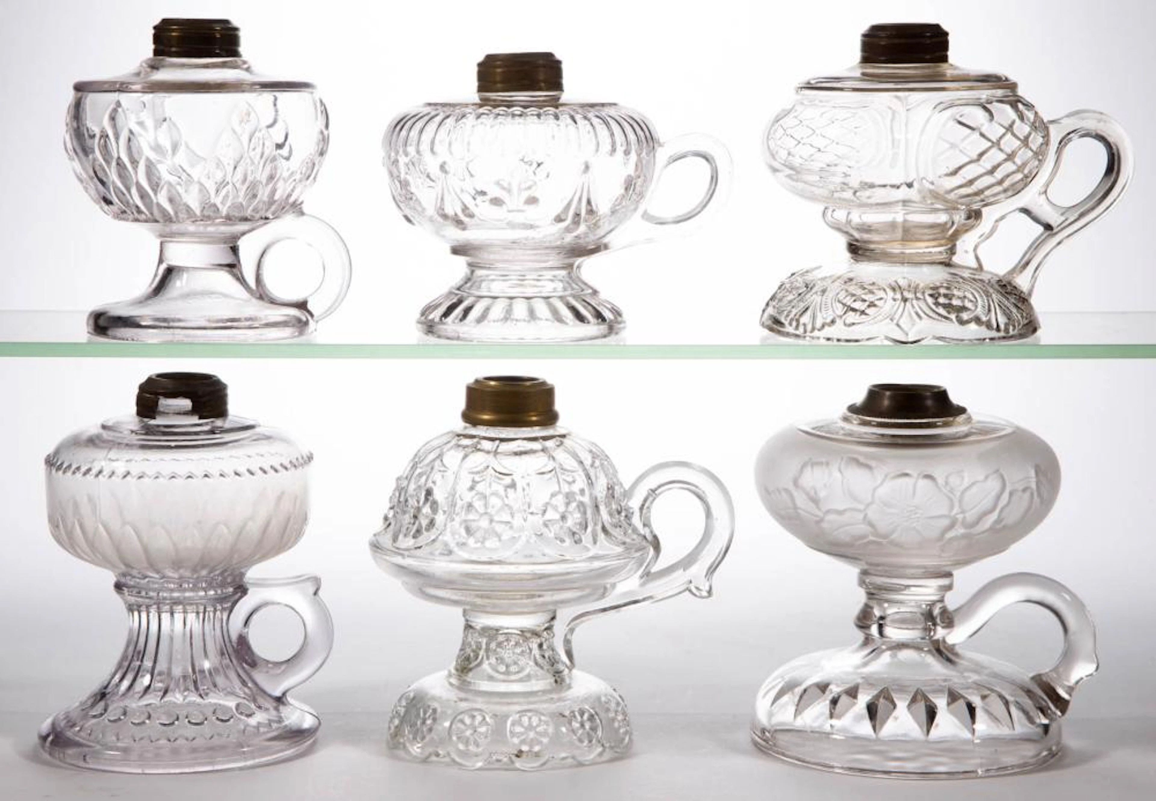 ASSORTED GLASS KEROSENE FOOTED FINGER LAMPS, LOT OF SIX