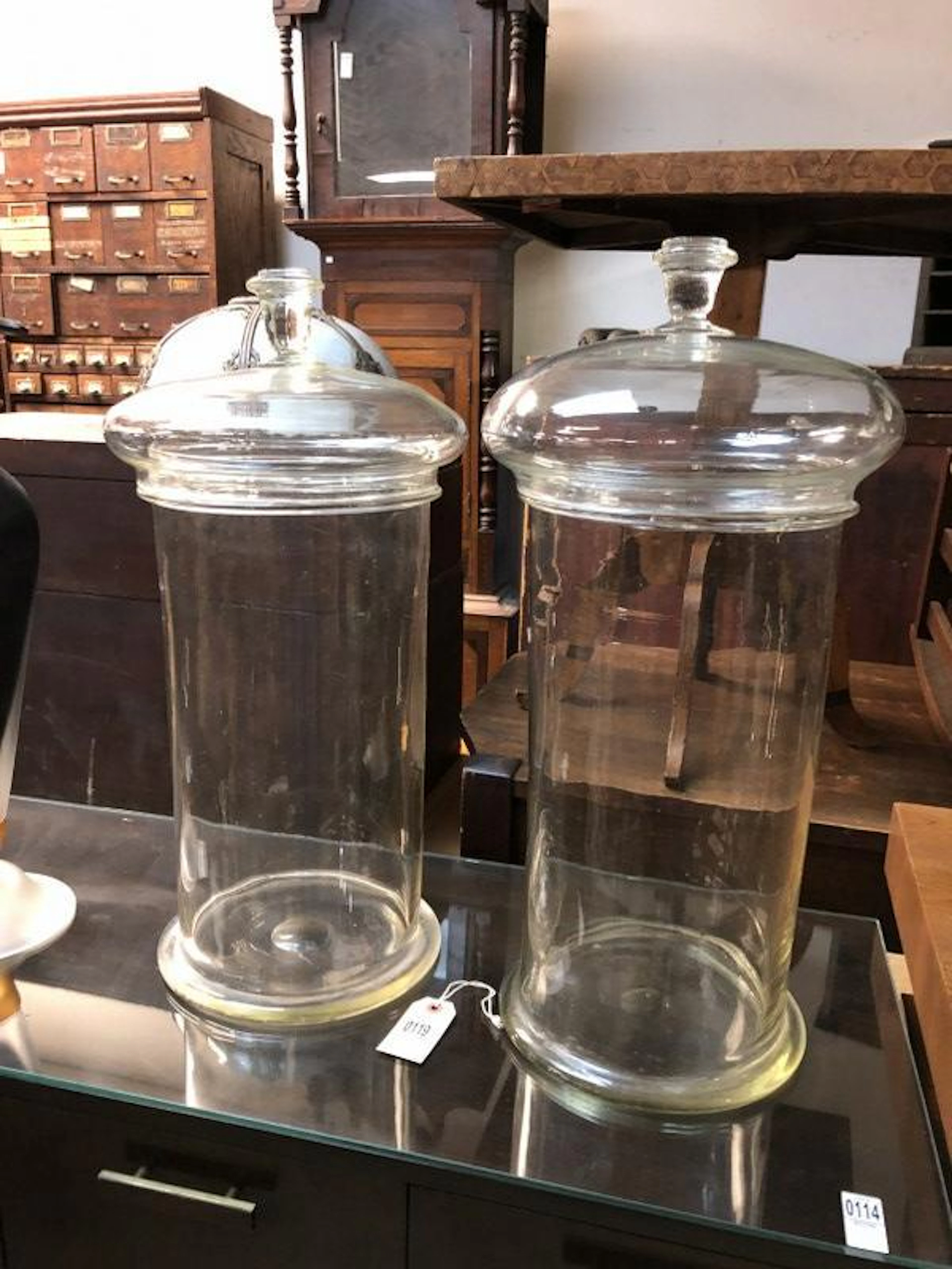 PAIR OF LARGE COVERED GLASS JARS W/LIDS FROM APOTHECARY